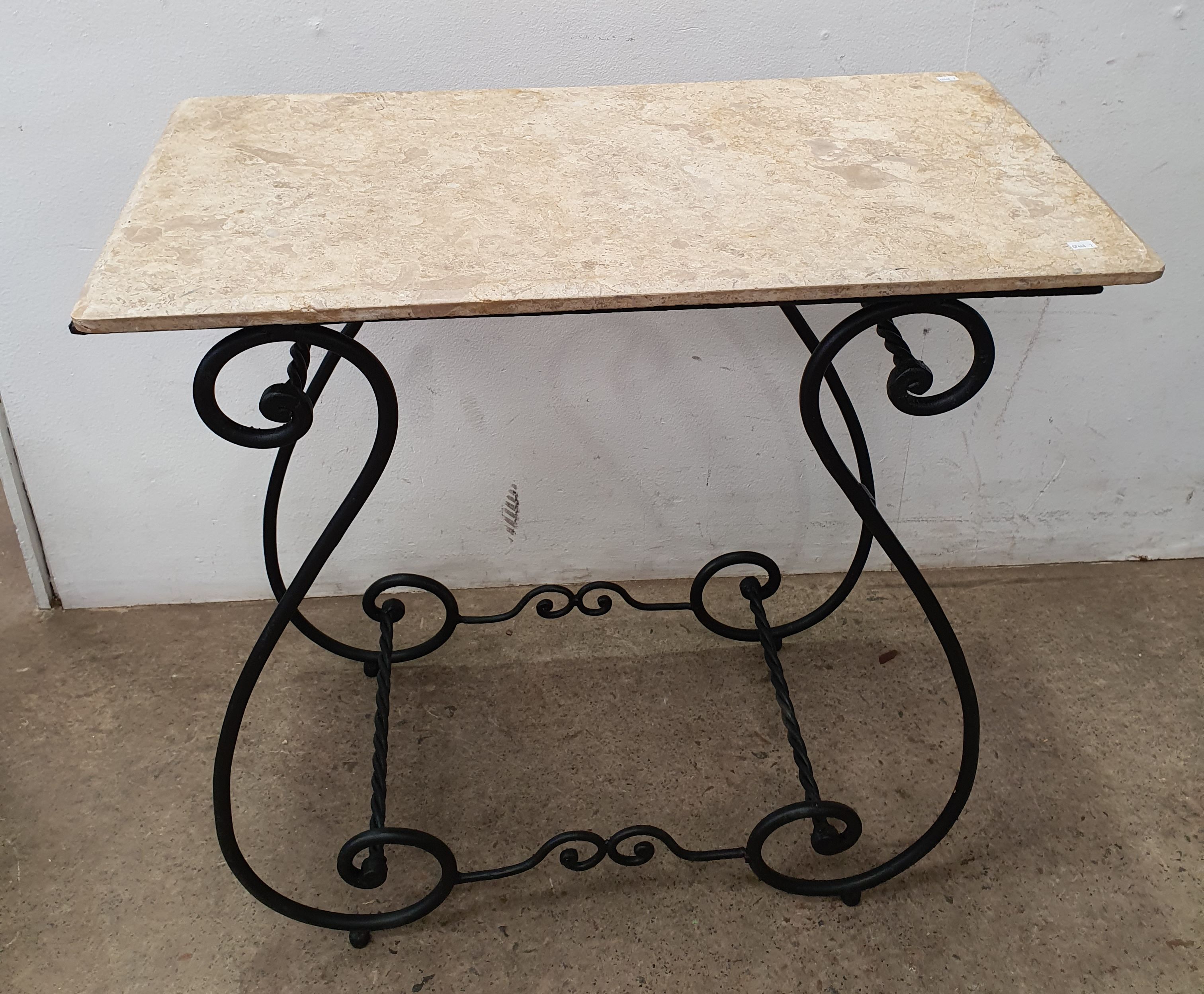 1001 · A GOOD WROUGHT IRON PATIO TABLE WITH STONE TOP