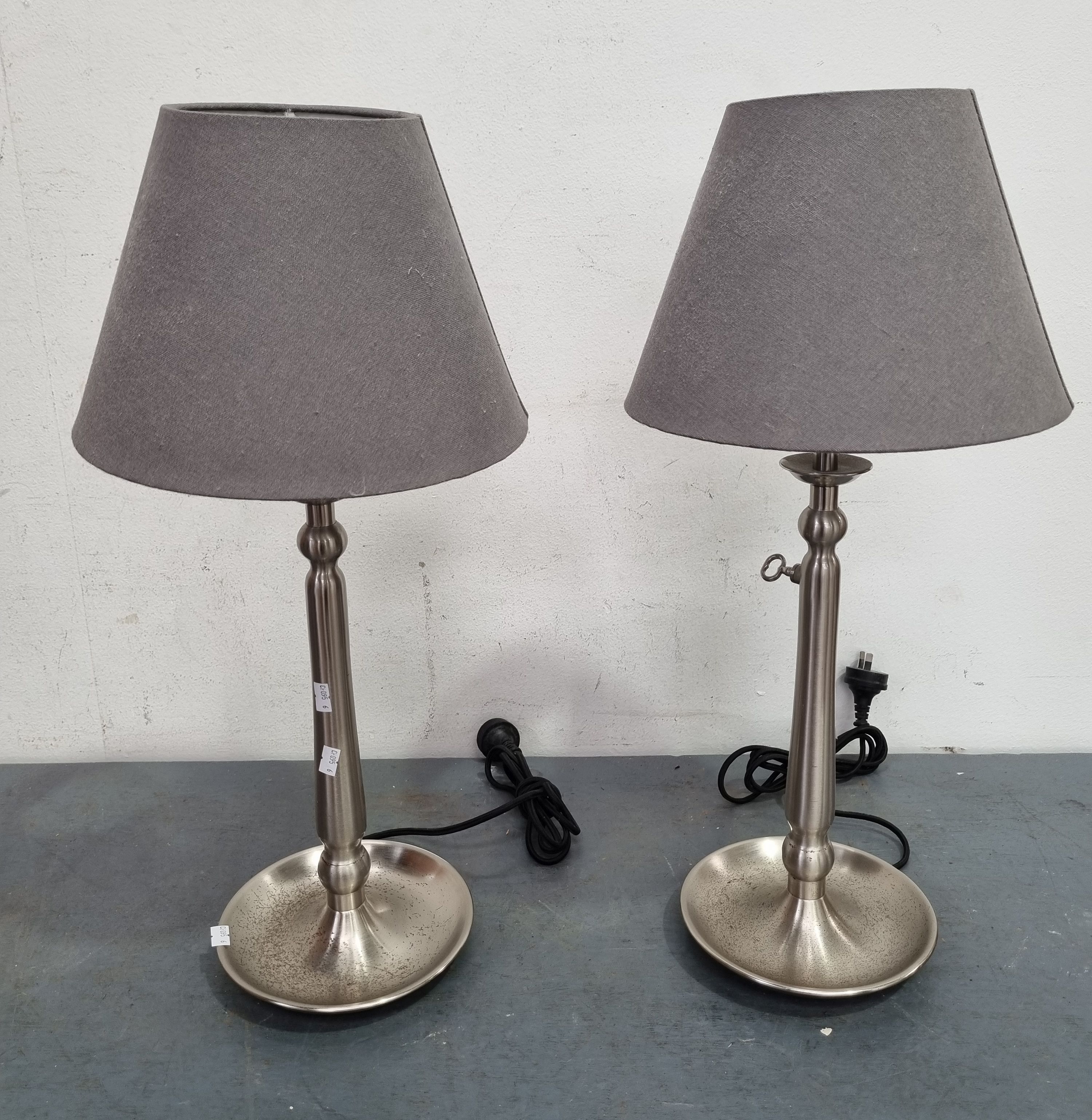 A Matching Pair Of Table Lamps