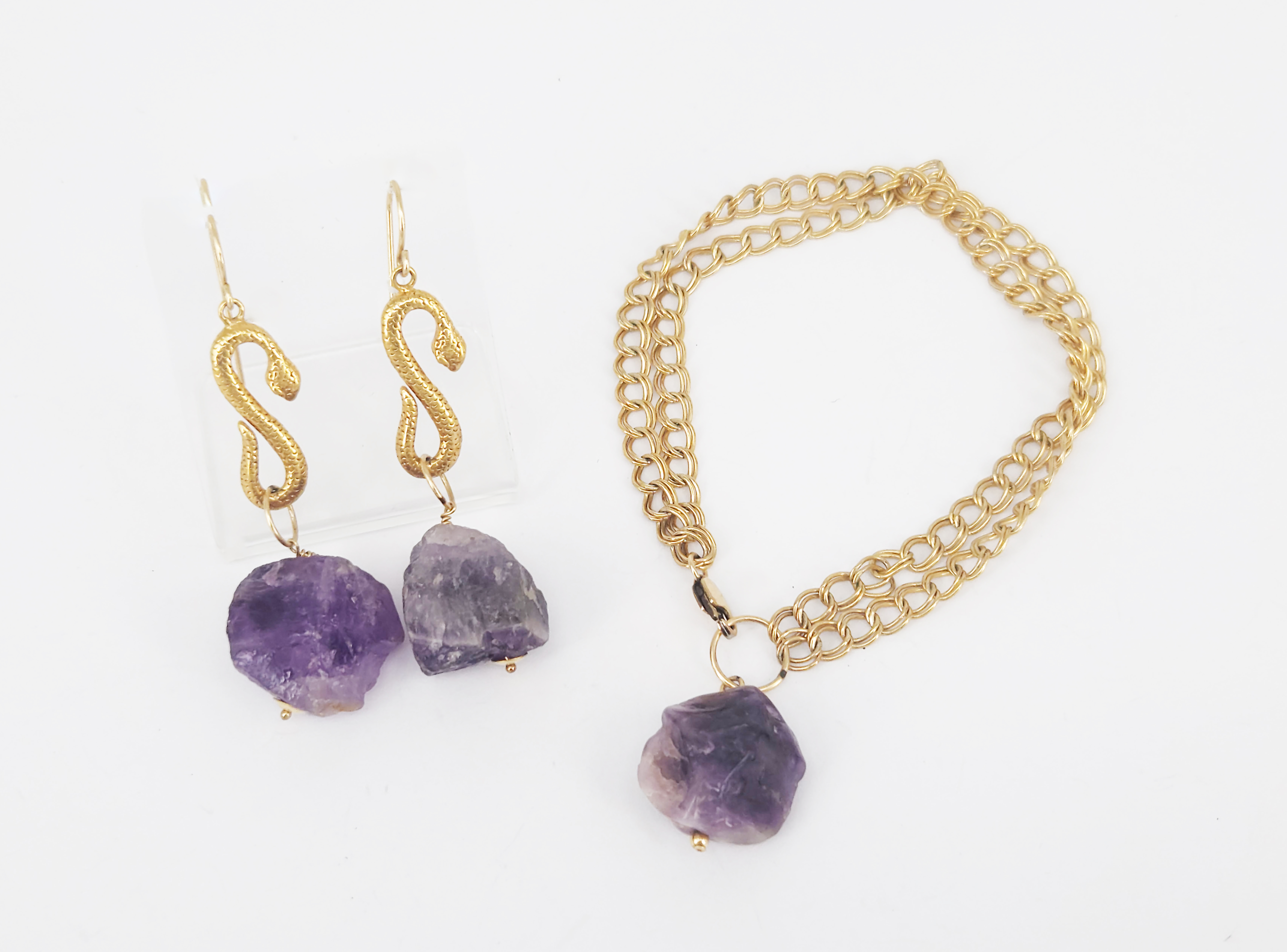 447 · A ROLLED GOLD AND AMETHYST BRACELET AND A PAIR OF SIMILAR EARRINGS