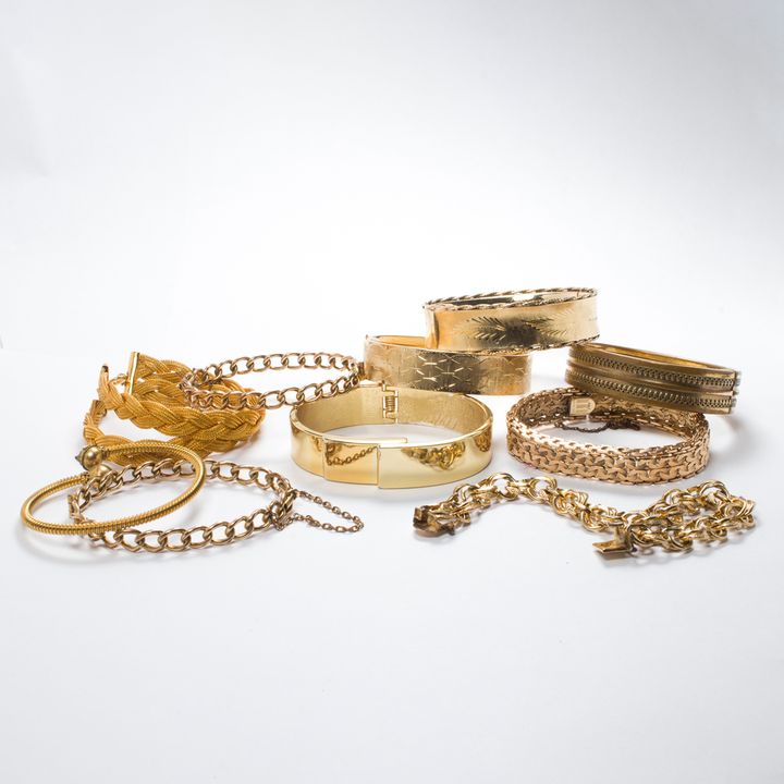 A group of costume bracelets