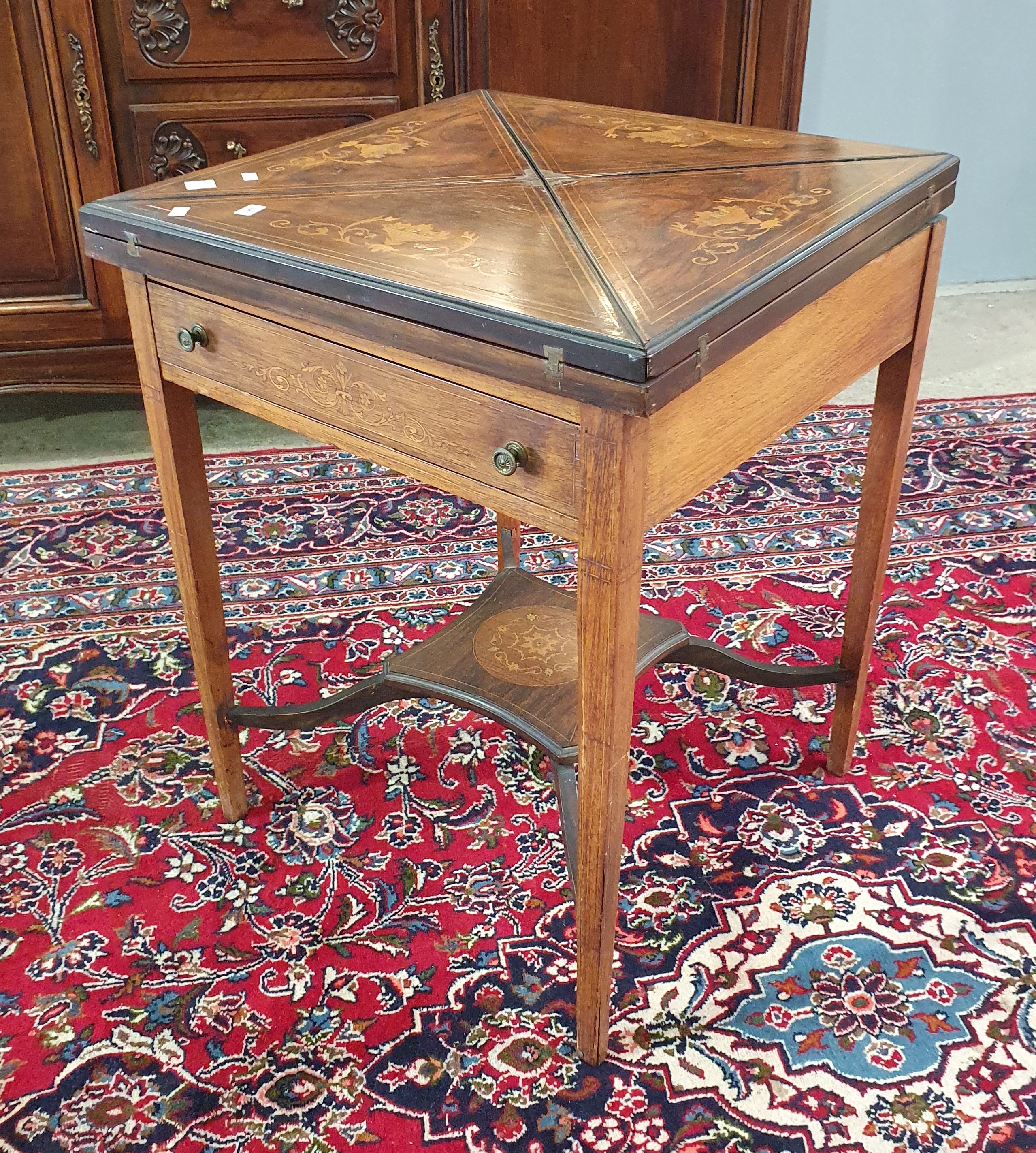 2067 · AN EDWARDIAN ROSEWOOD SHERATON STYLE ENVELOPE GAMES TABLE