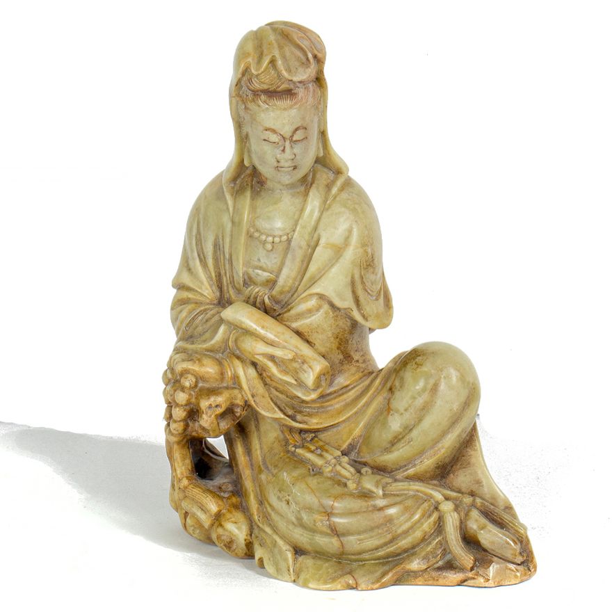 A Chinese soapstone carved figure of Guanyin