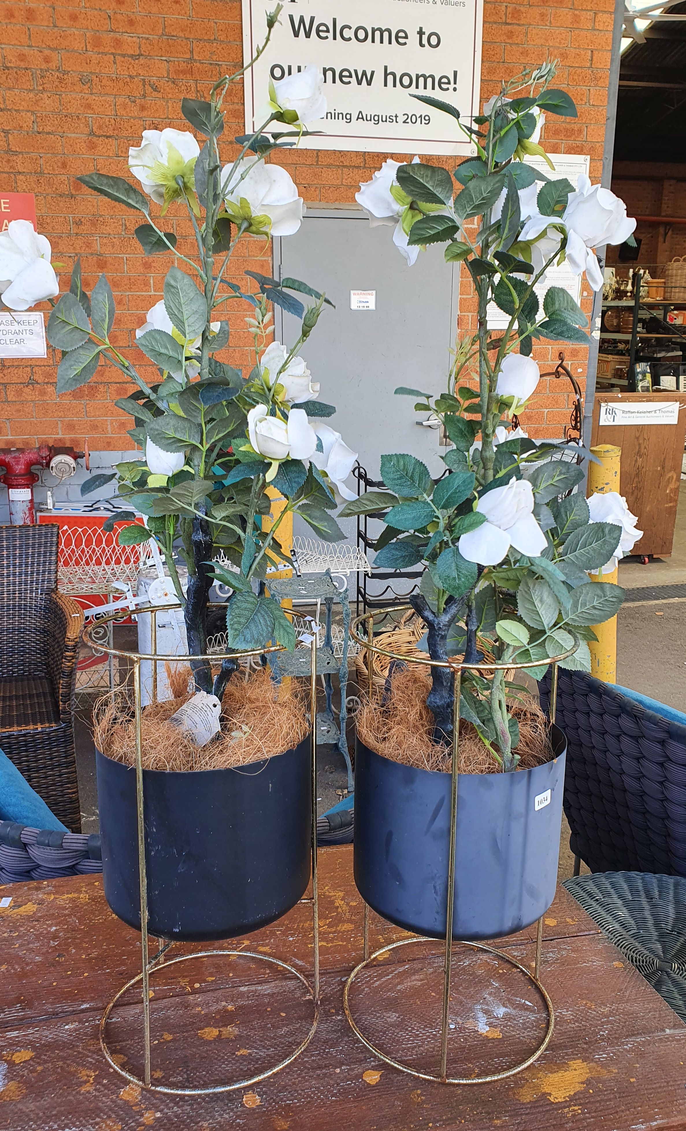 1034 · A PAIR OF FAUX ROSE PLANTS