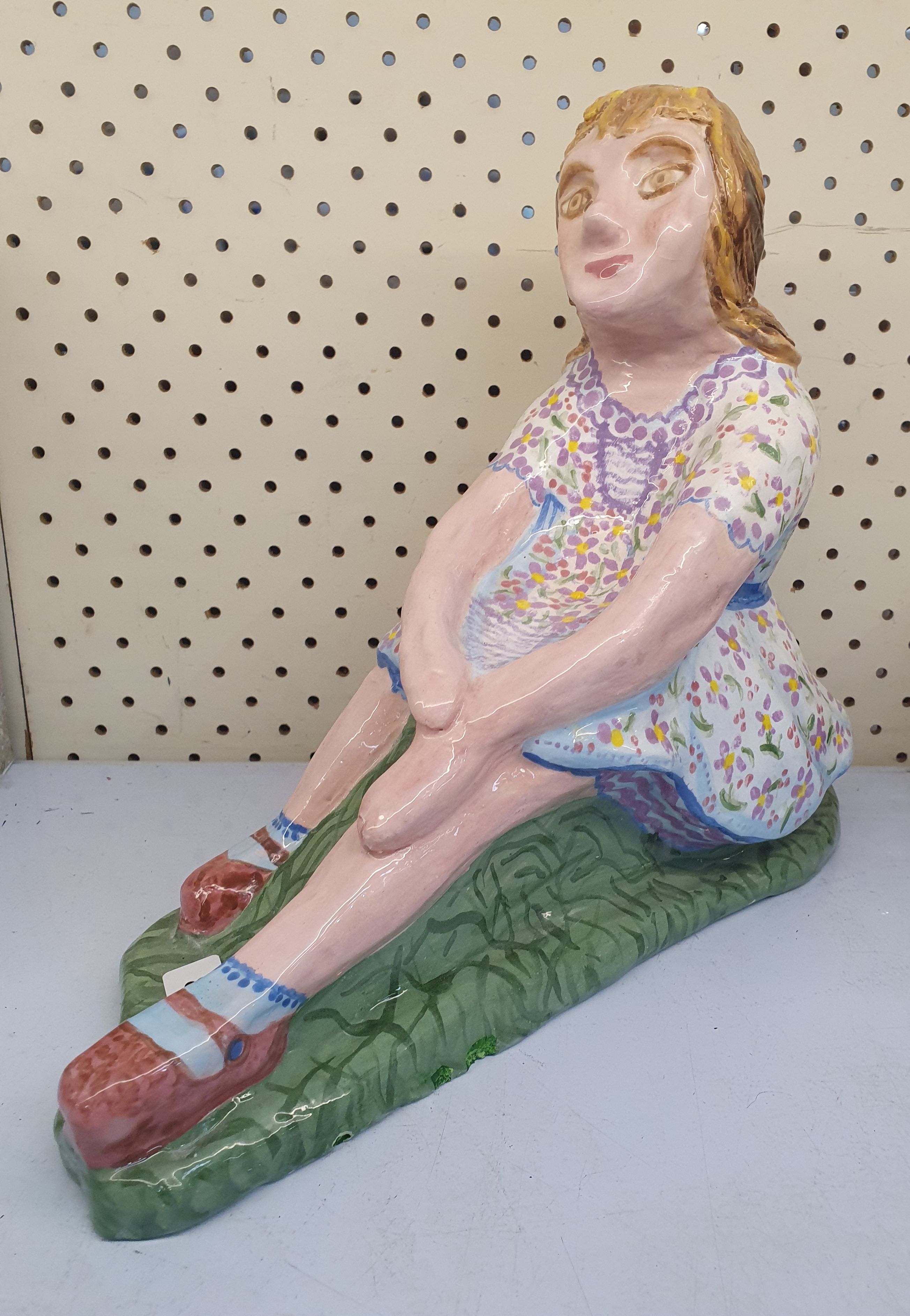 80 · A 'RELAXING GIRL' CERAMIC ORNAMENT
