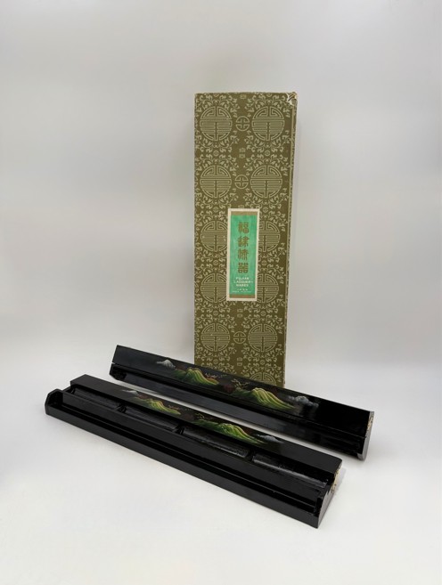 A SET OF FOUR CHINESE BLACK LACQUER MAHJONG TILE HOLDERS AND RESTS