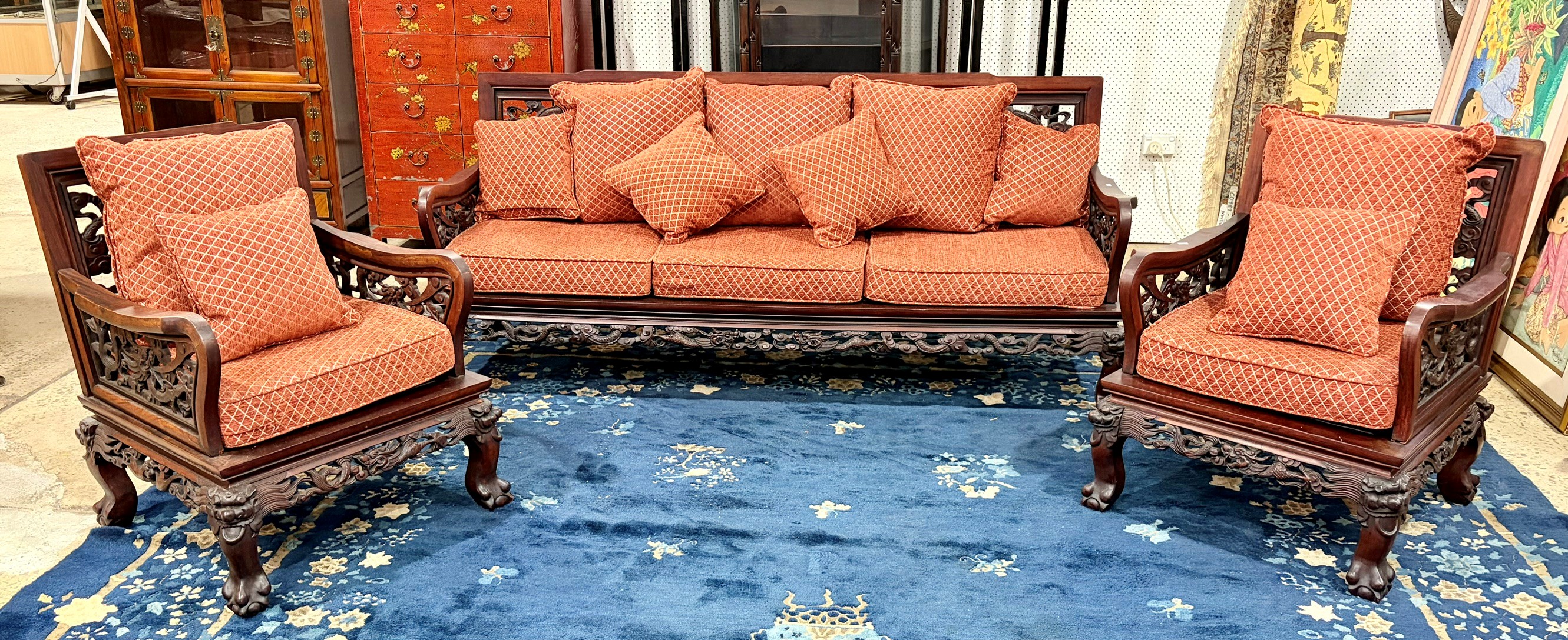 A CHINESE CARVED ROSEWOOD THREE PIECE SUITE