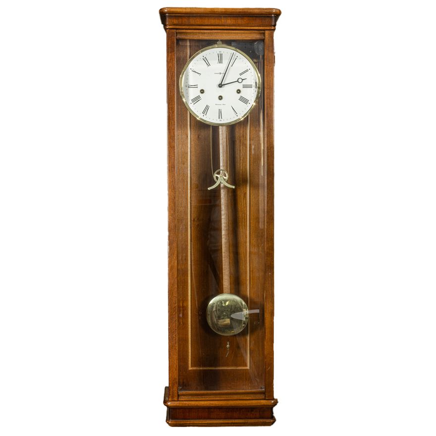 A Howard Miller cherry 'Milan' wall clock with Westminster chime