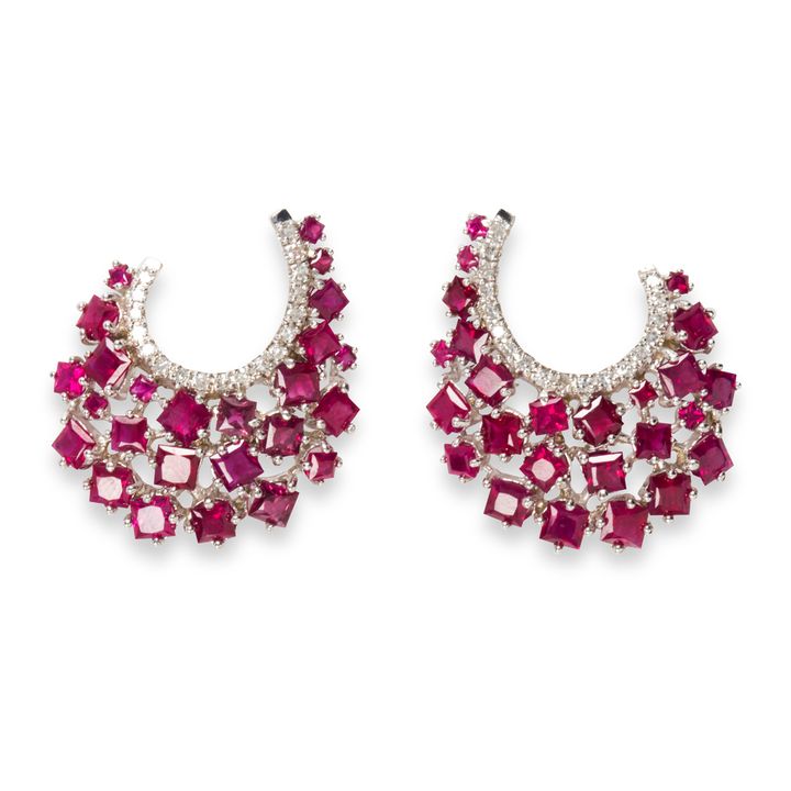 A pair of ruby, diamond and eighteen karat white gold earrings