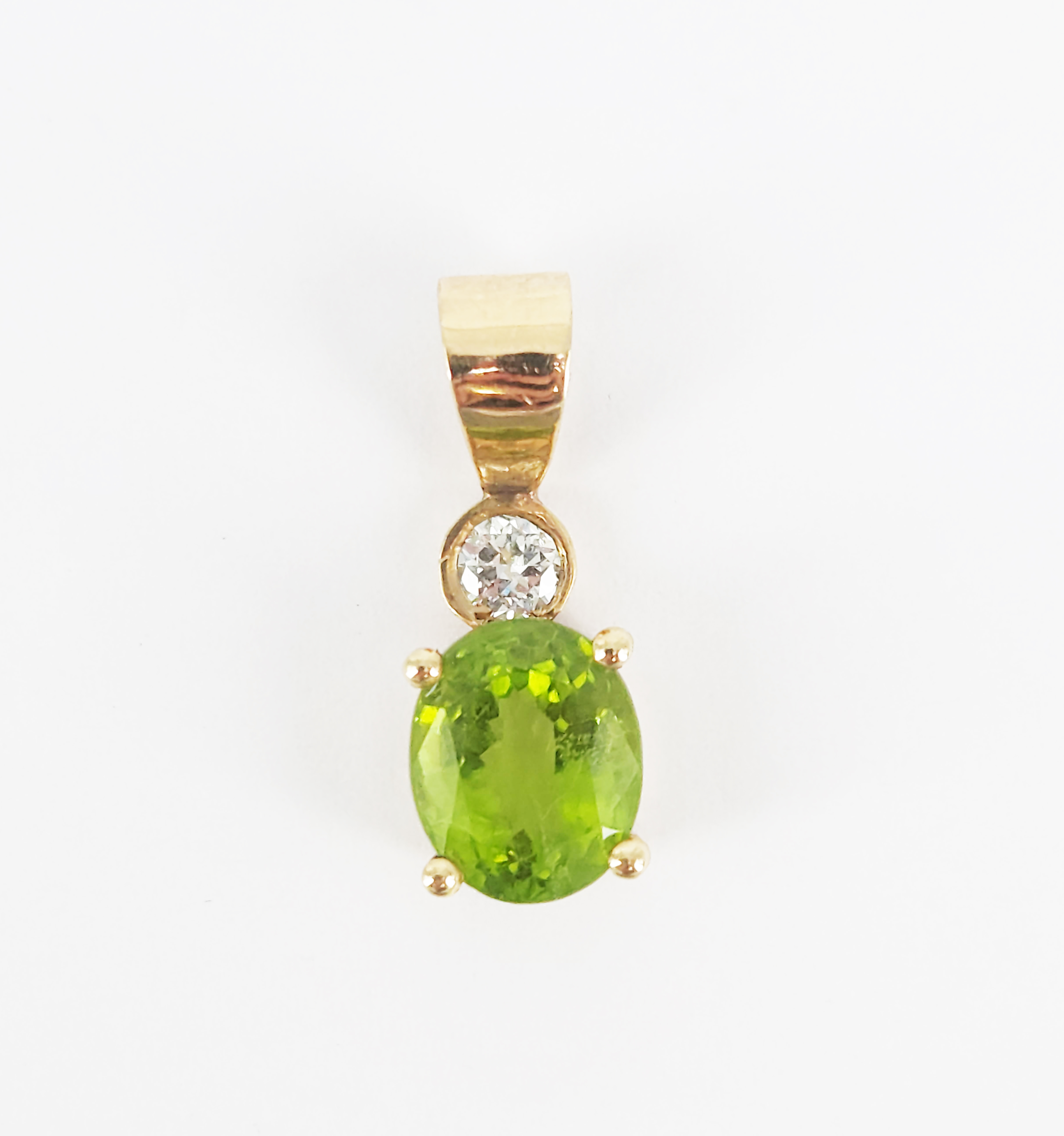 A 9ct Yellow Gold Peridot And Diamond Pendant
