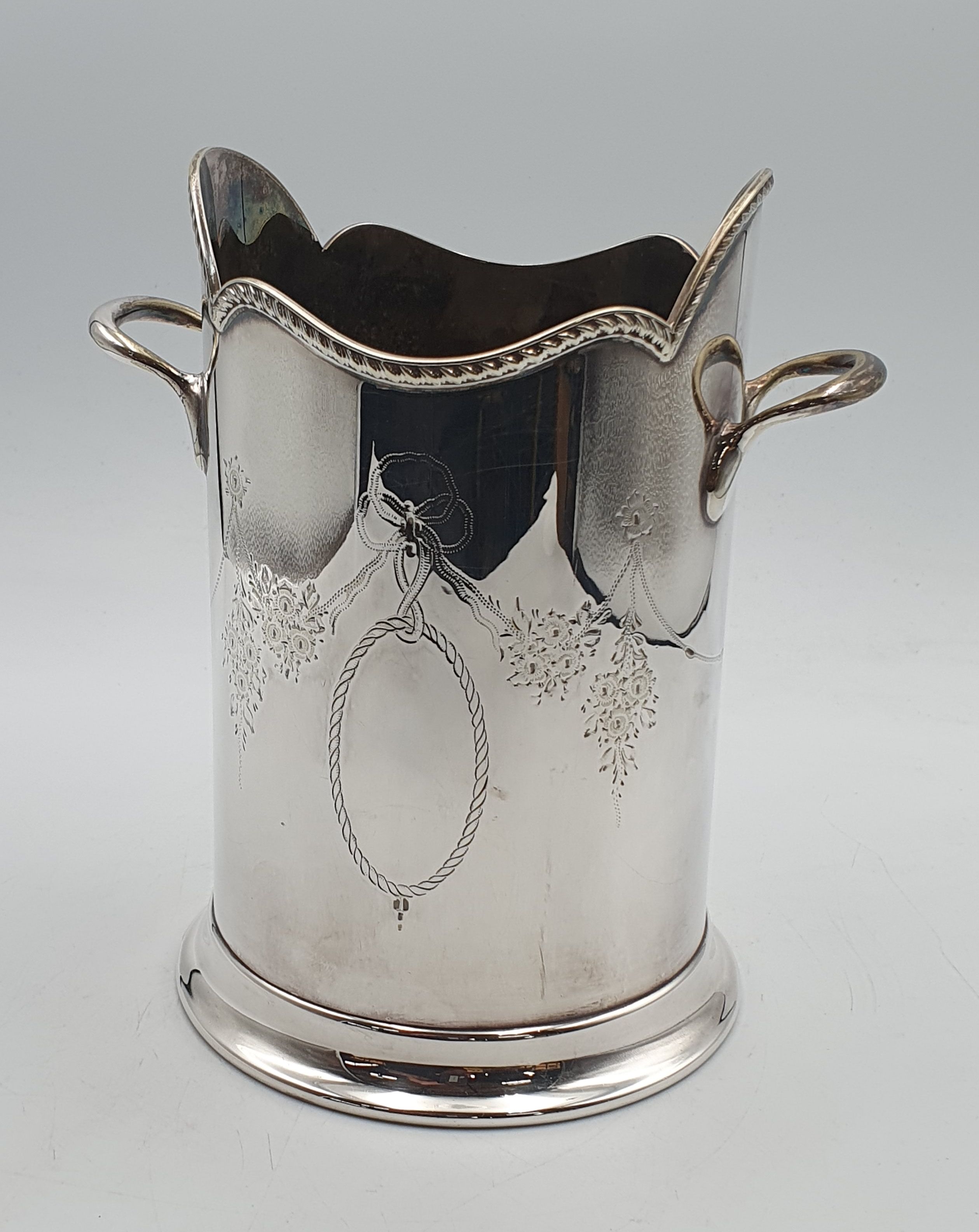 88 · A VICTORIAN STYLE SILVERPLATED WINE BOTTLE STAND
