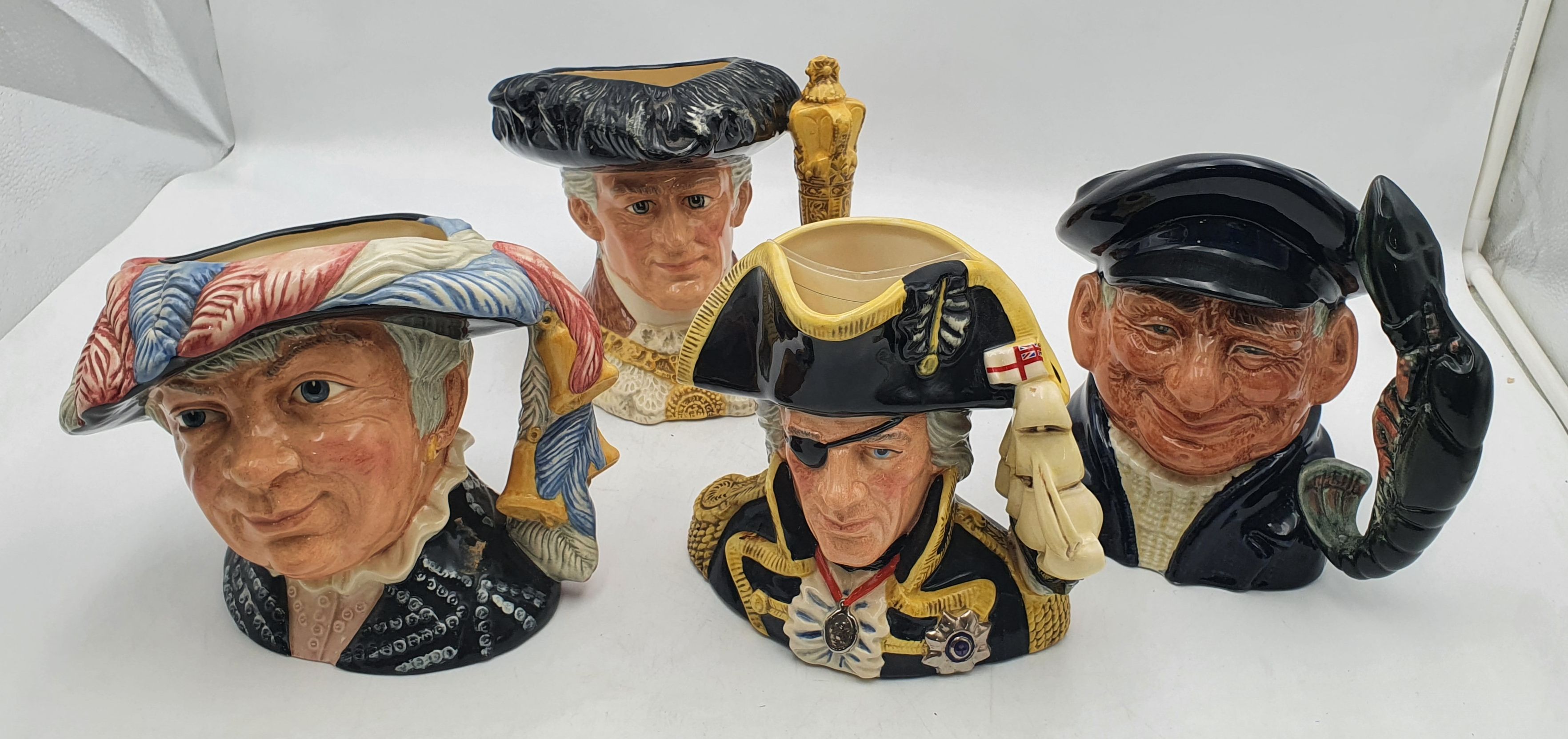 157 · FOUR ROYAL DOULTON CHARACTER JUGS