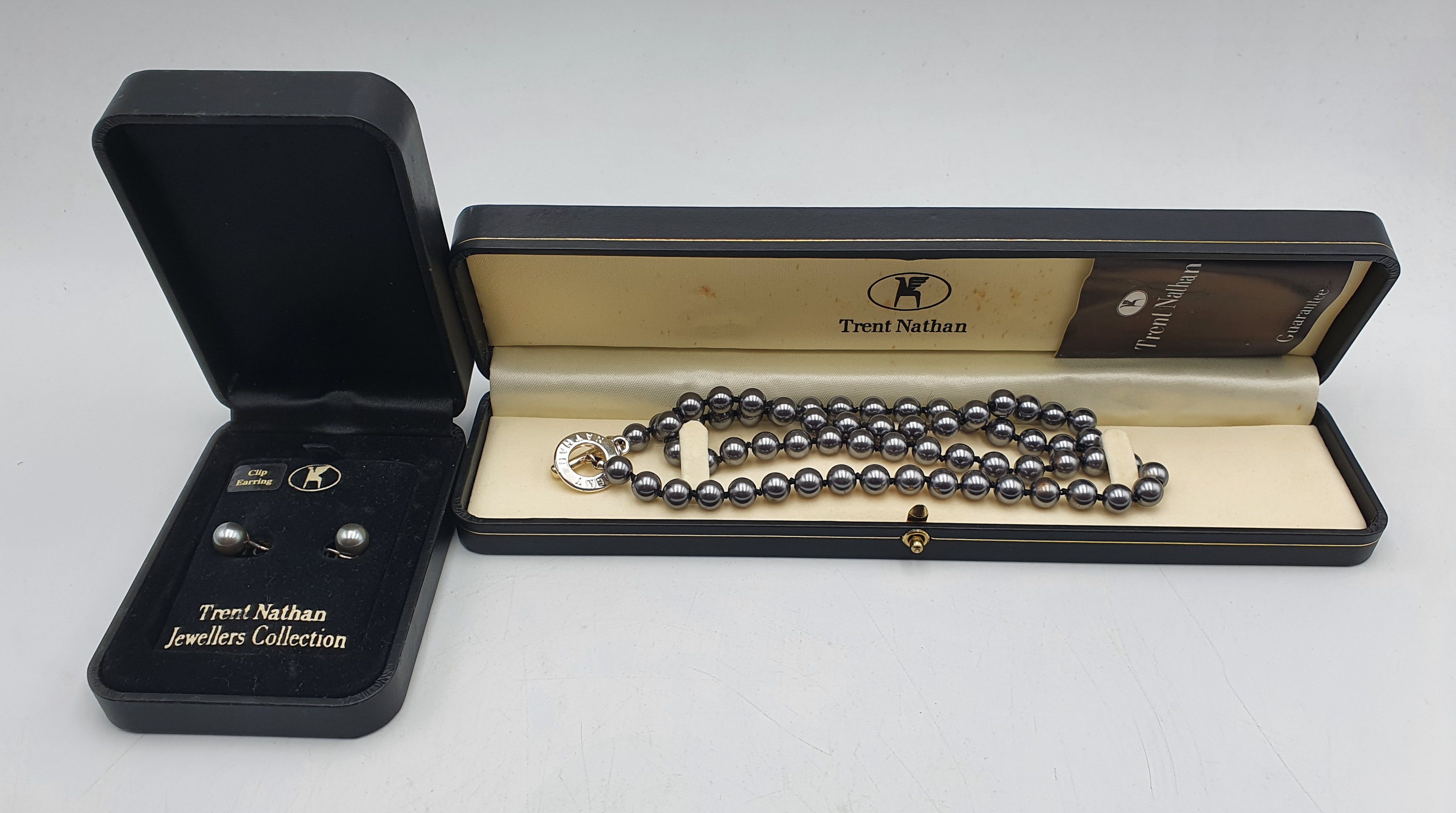 279 · A TRENT NATHAN FAUX PEARL NECKLACE AND MATCHING CLIP-ON EARRINGS
