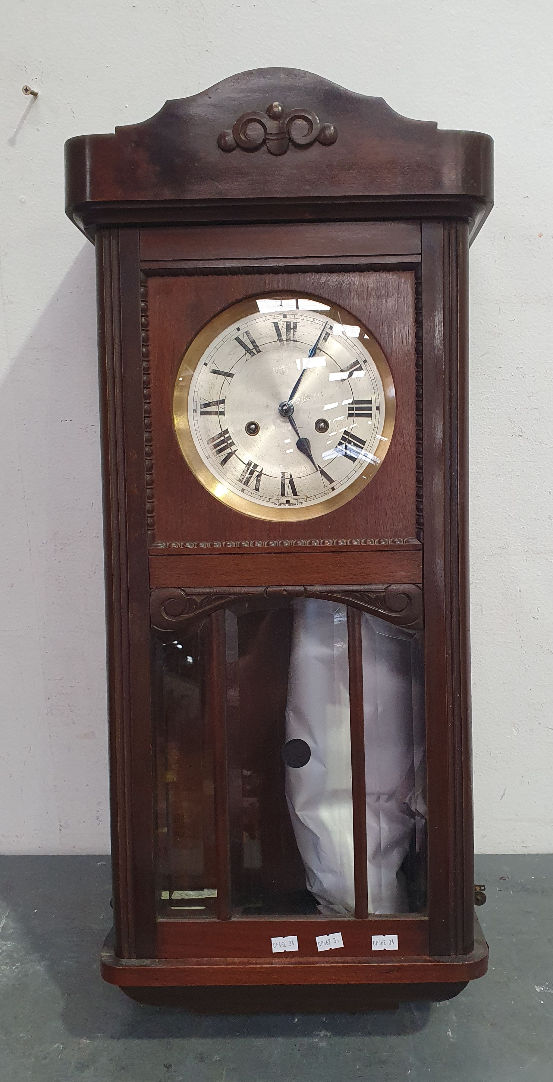 A MAHOGANY WALL CLOCK