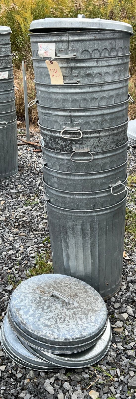 NINE 20 GAL. GALVANIZED GARBAGE CANS WITH LIDS. Teel Auctions