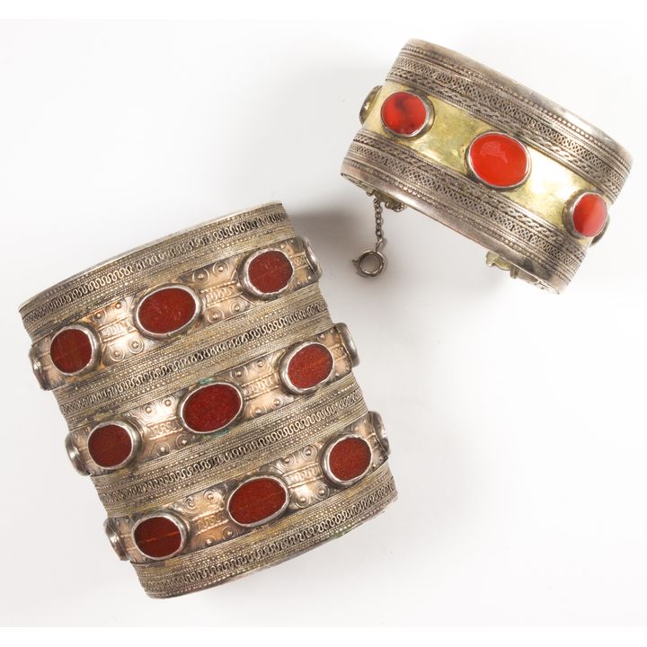 A pair Afghan carnelian, silver and gold tired bangles