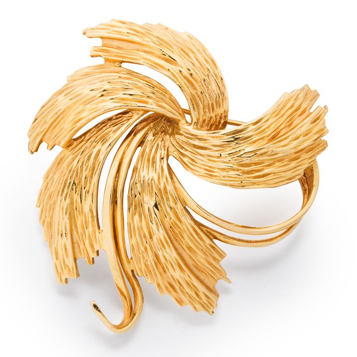 A fourteen karat gold brooch