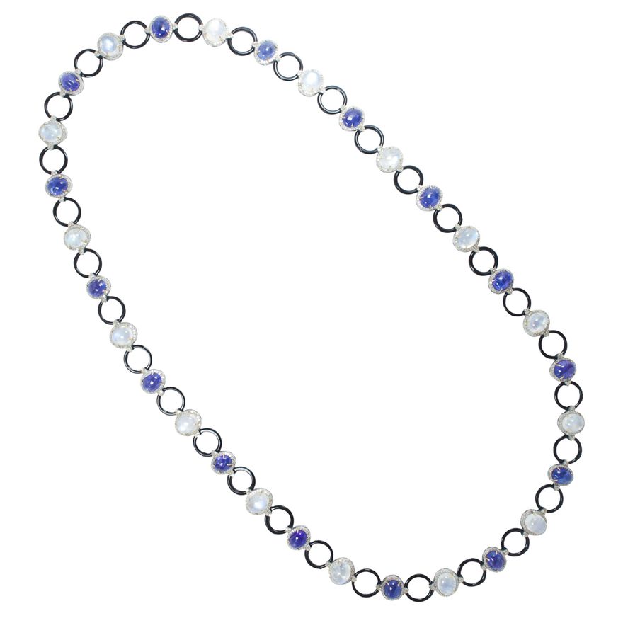A tanzanite, moonstone, black onyx and silver necklace