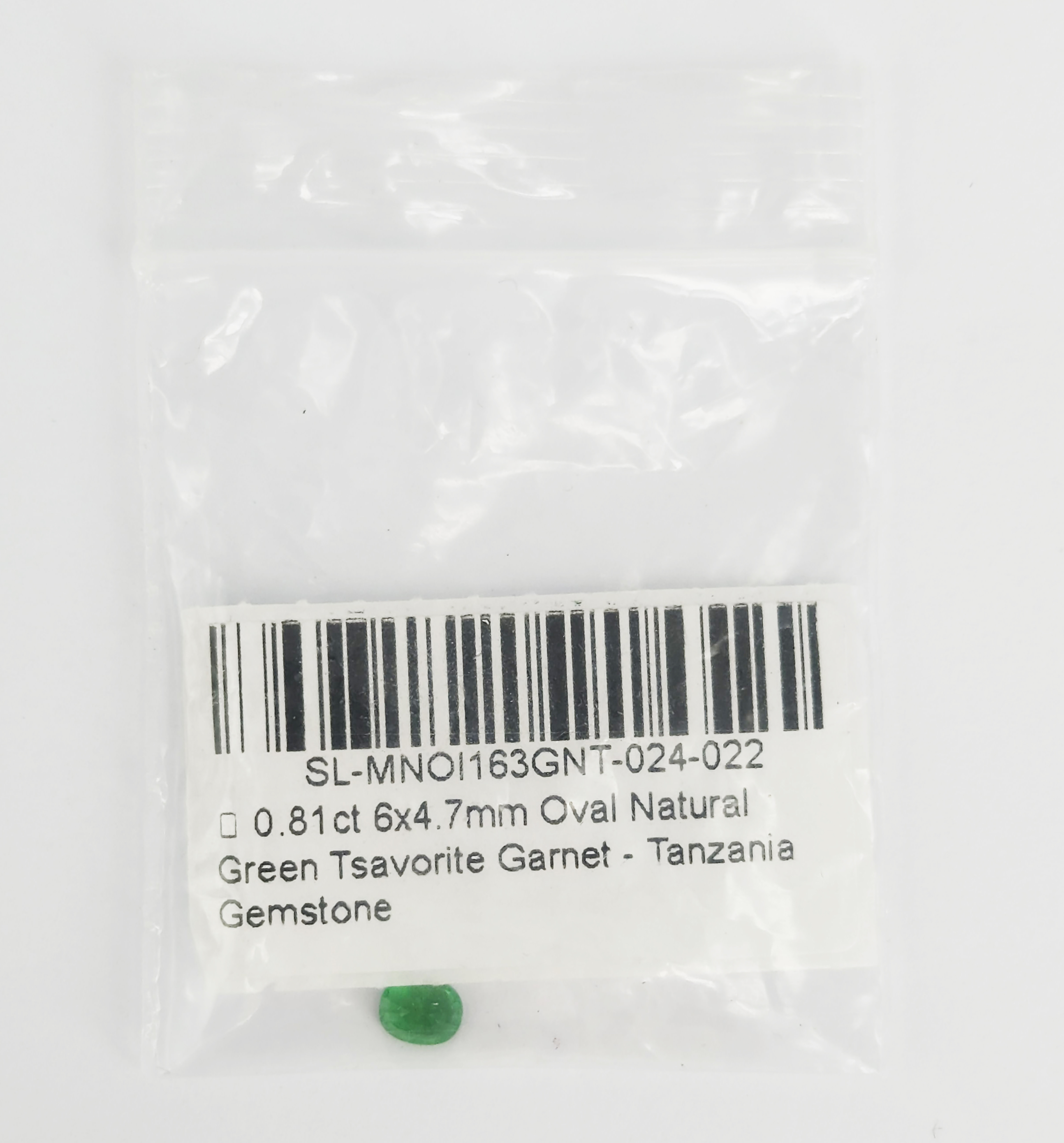 A LOOSE OVAL CUT TANZANIAN GREEN TSAVORITE GARNET