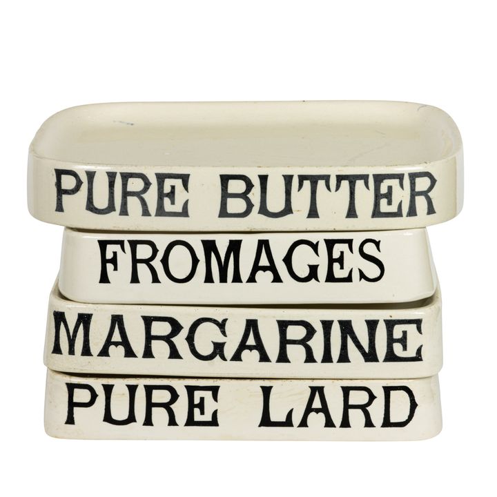 Four English ironstone advertising display stands