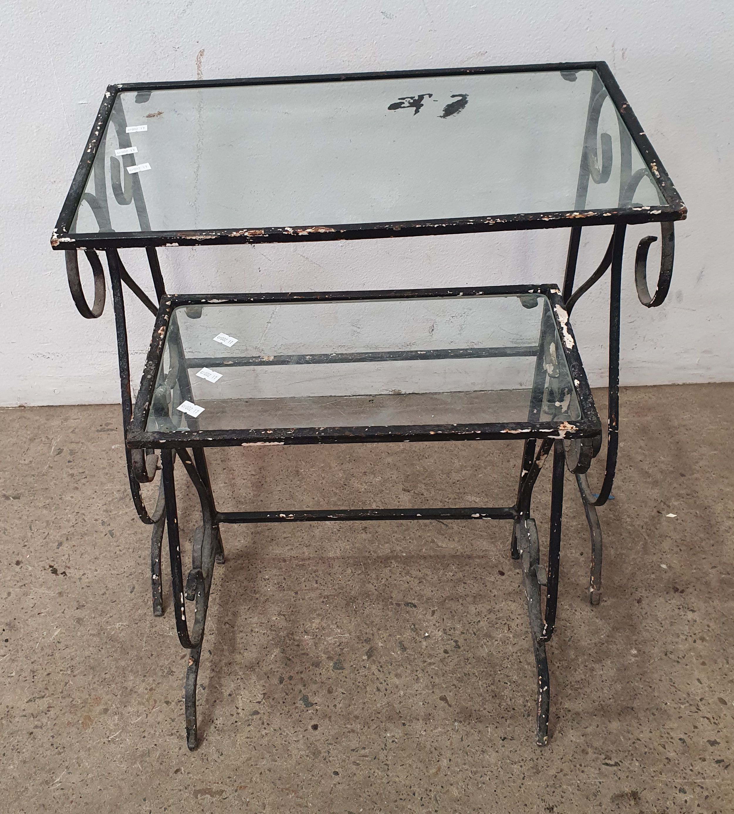 1015 · A NEST OF TWO METAL GLASS TOP TABLES