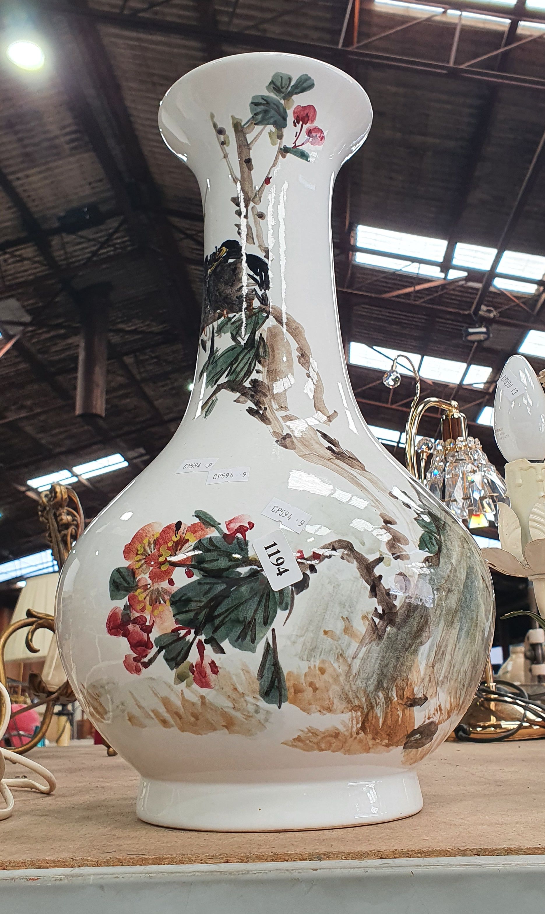 1194 · A FLORAL DESIGN CERAMIC VASE