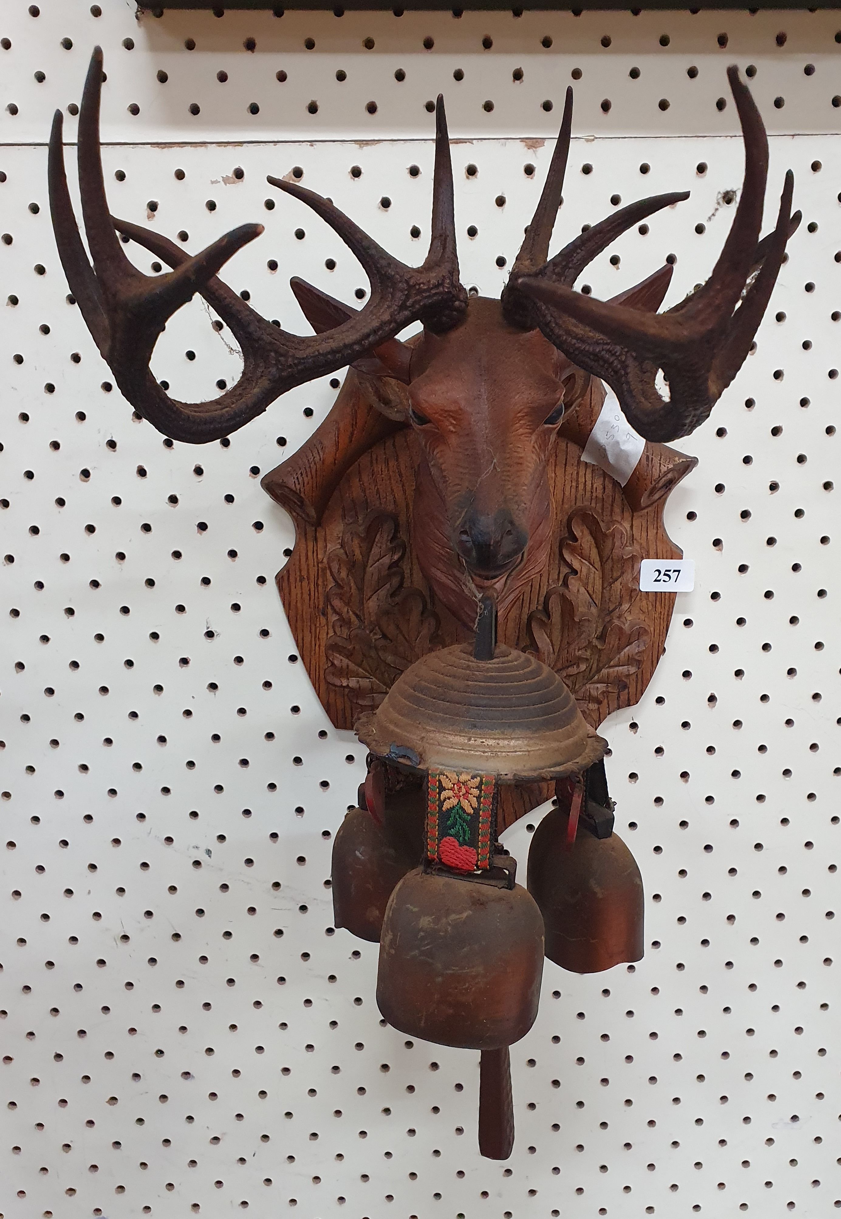 257 · A VINTAGE PLASTIC DEER HEAD WITH BRASS BELLS