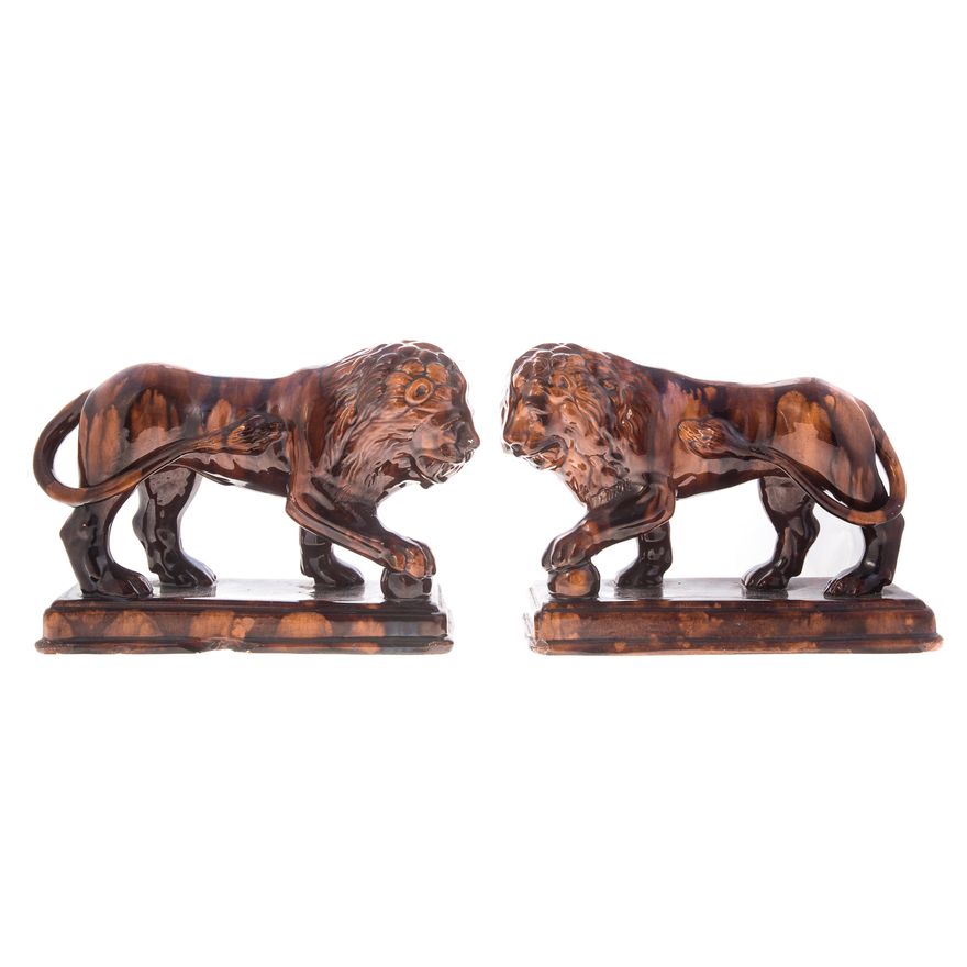 Pair of Rockingham pottery standing lions