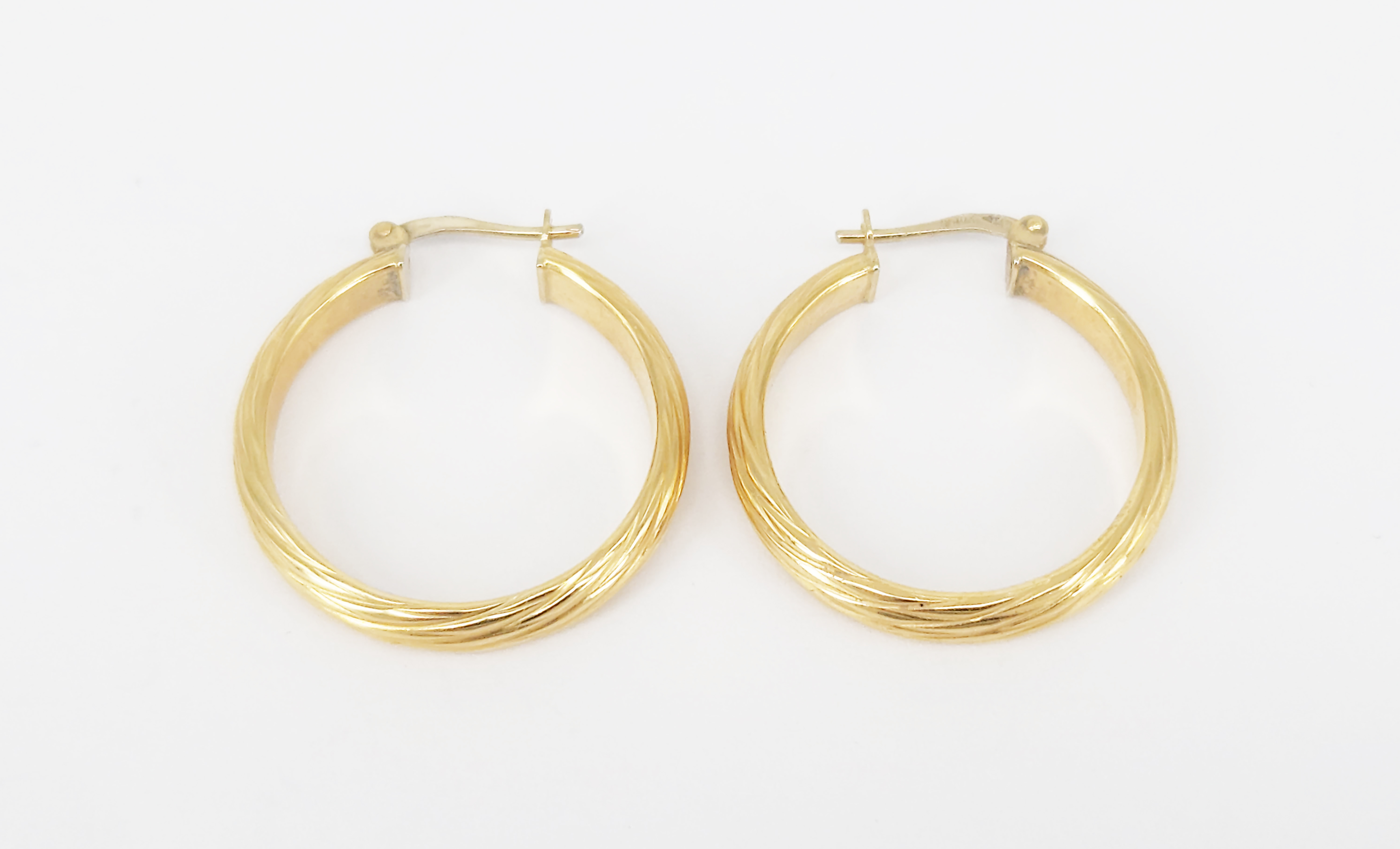 A Pair Of Italian 18ct Yellow Gold Twsit Hoop Earrings