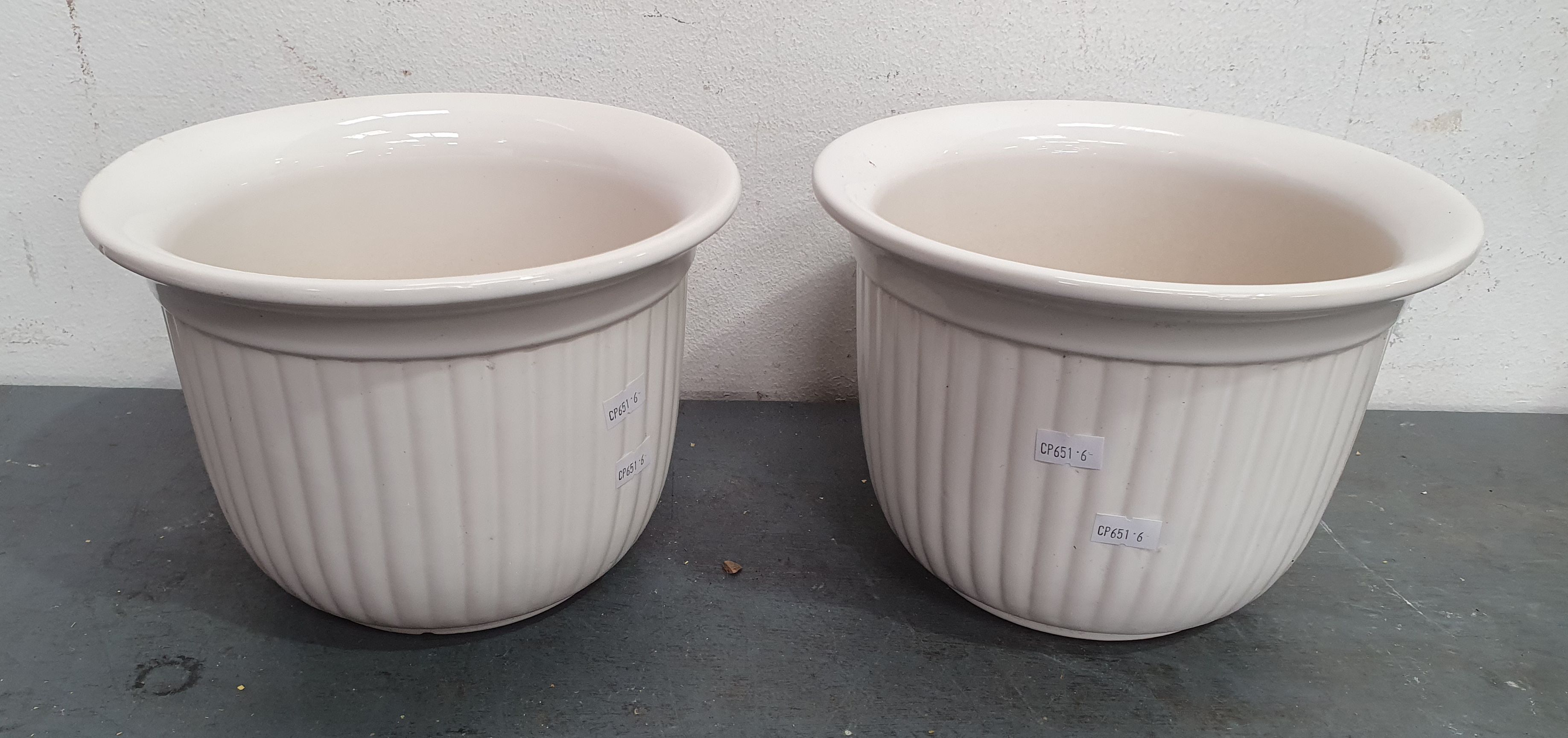 1067 · A PAIR OF AUSTRALIAN CERAMIC PLANTERS