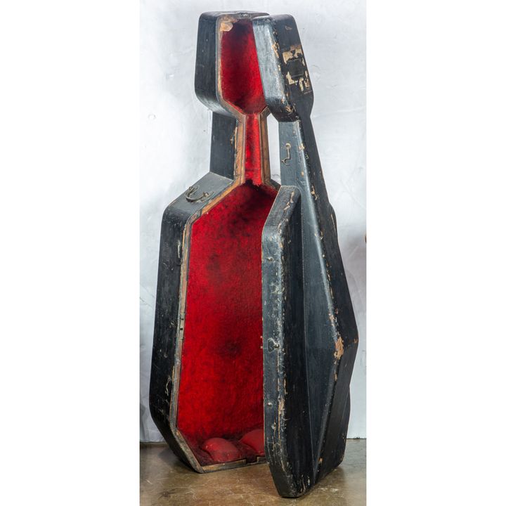 Vintage cello case made of black painted wood with red fabric lining, 50"h