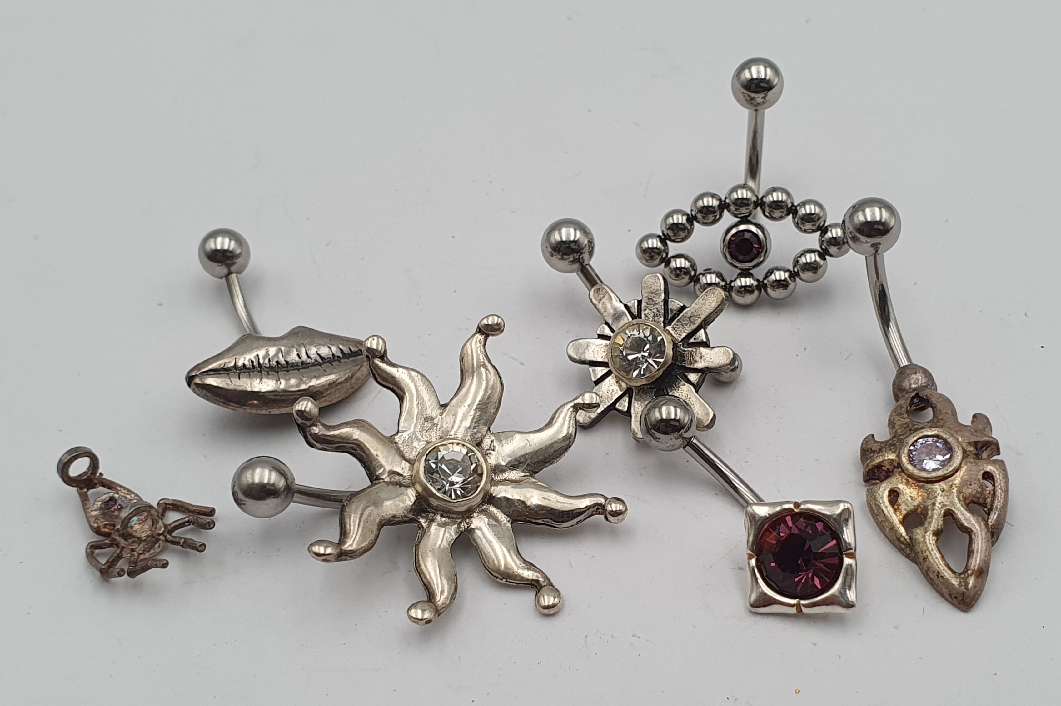 A QUANTITY OF STERLING SILVER BODY JEWELLERY