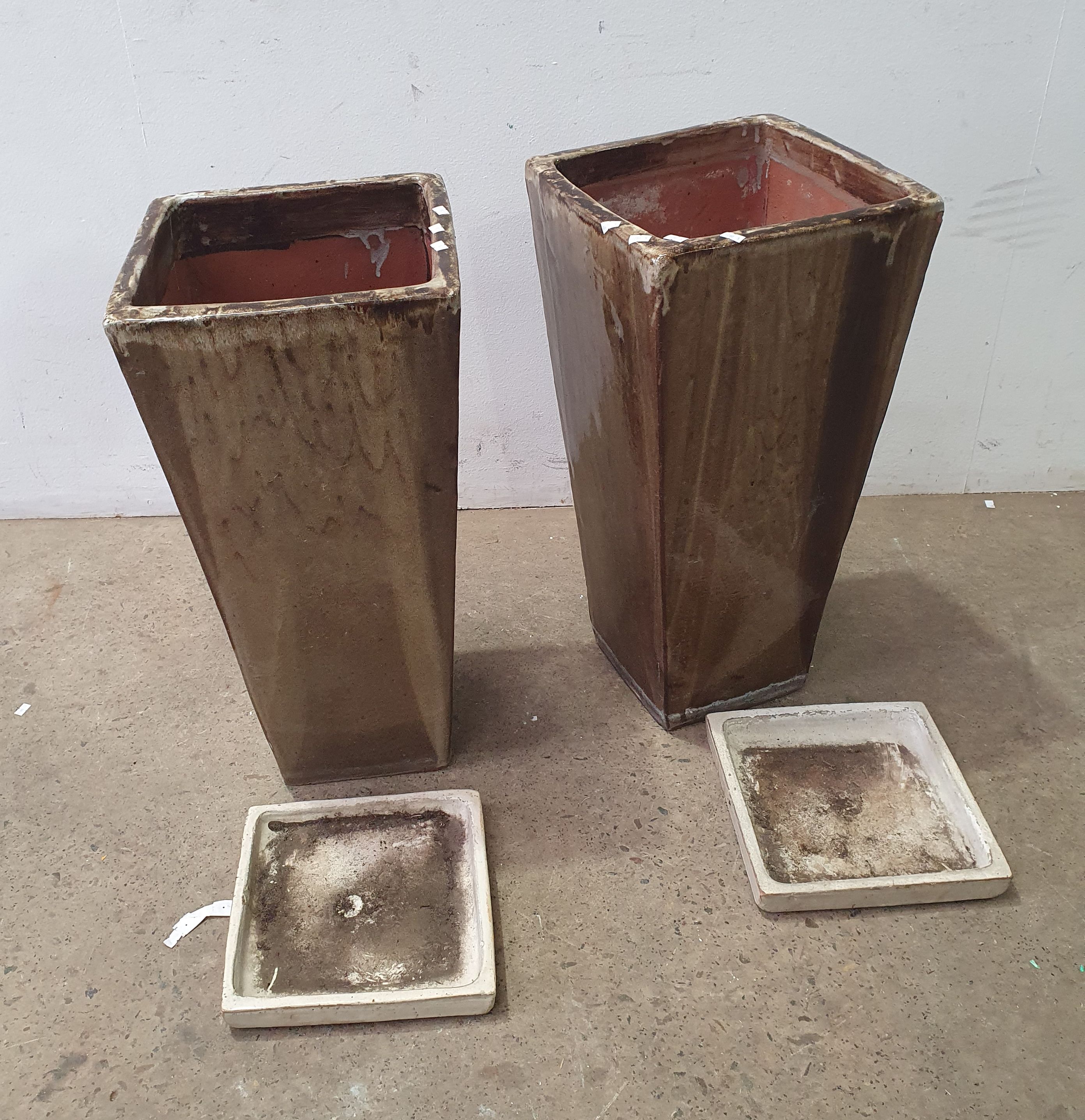 A Pair Of Glazed Pots