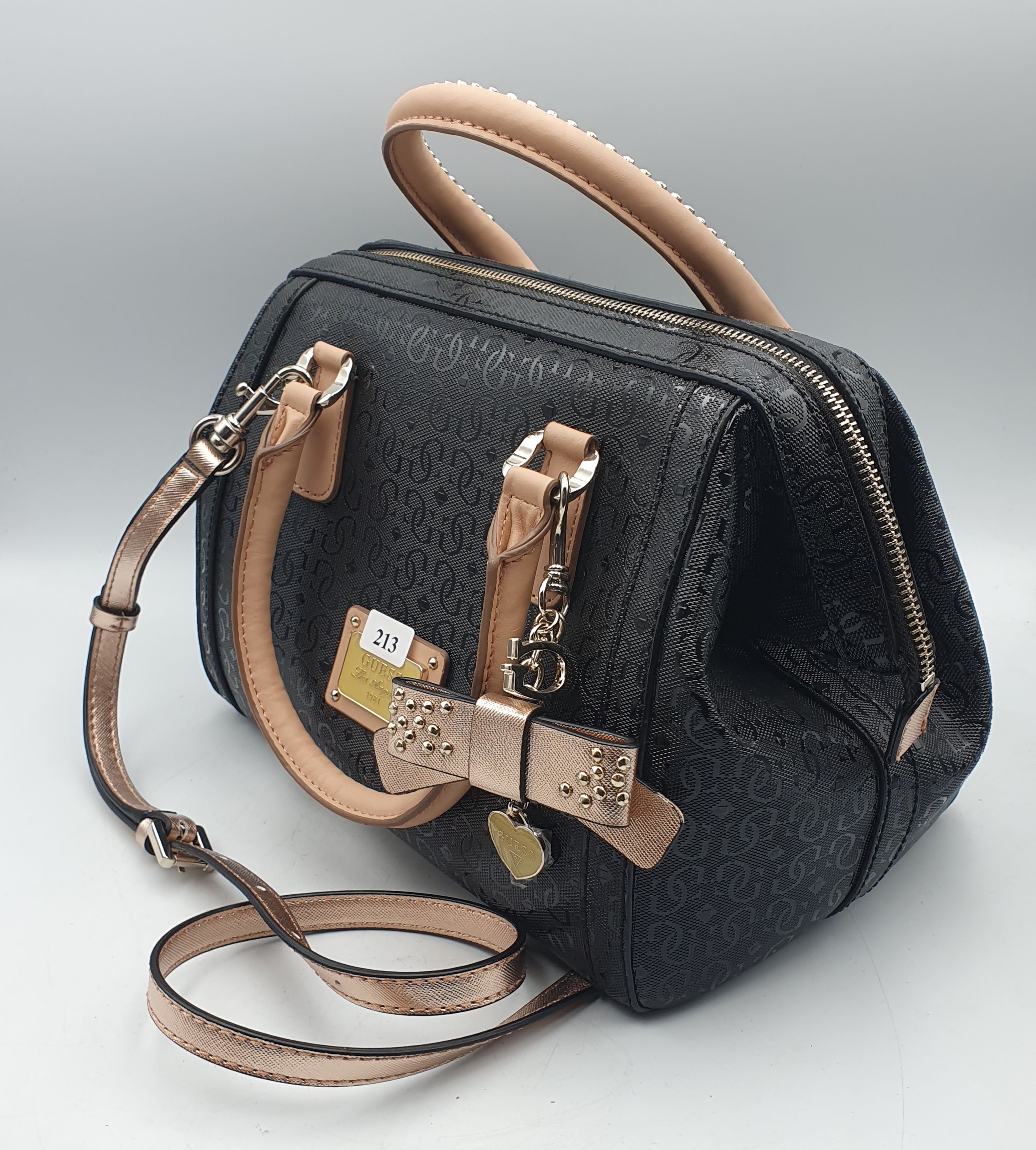 213 · A LADIES GUESS BLACK FLORAL BAG