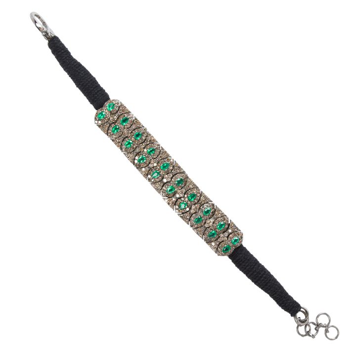 An emerald, diamond, silver and cord bracelet