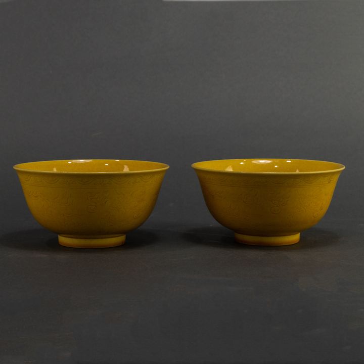 Pair of Chinese yellow glazed 'dragon' bowls