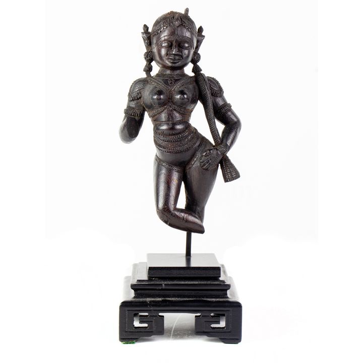 An Indian wood carved figures with stand