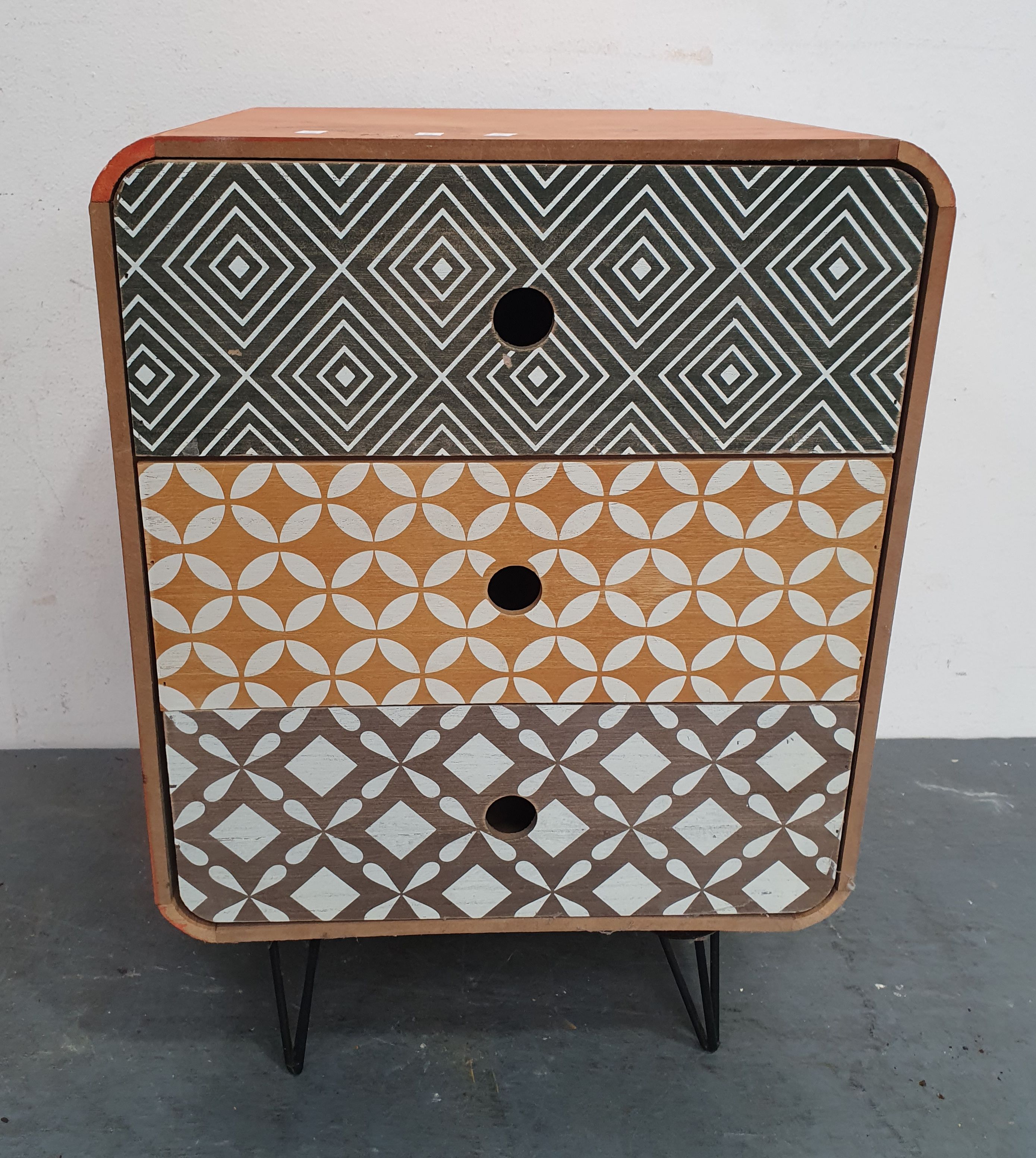 A PAINTED THREE DRAWER BEDSIDE