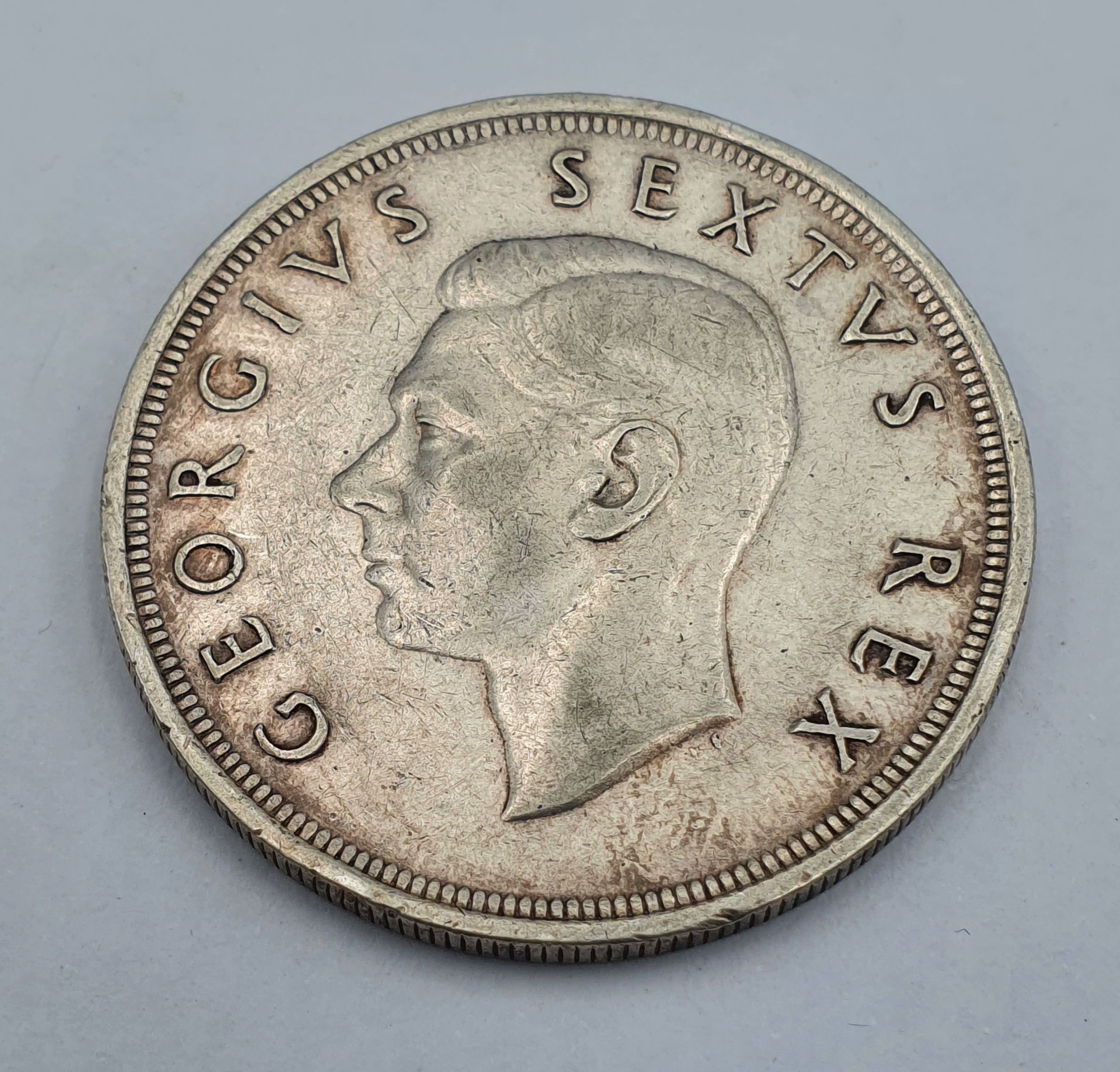 A LARGE SOUTH AFRICAN SILVER FIVE SHILLING COIN