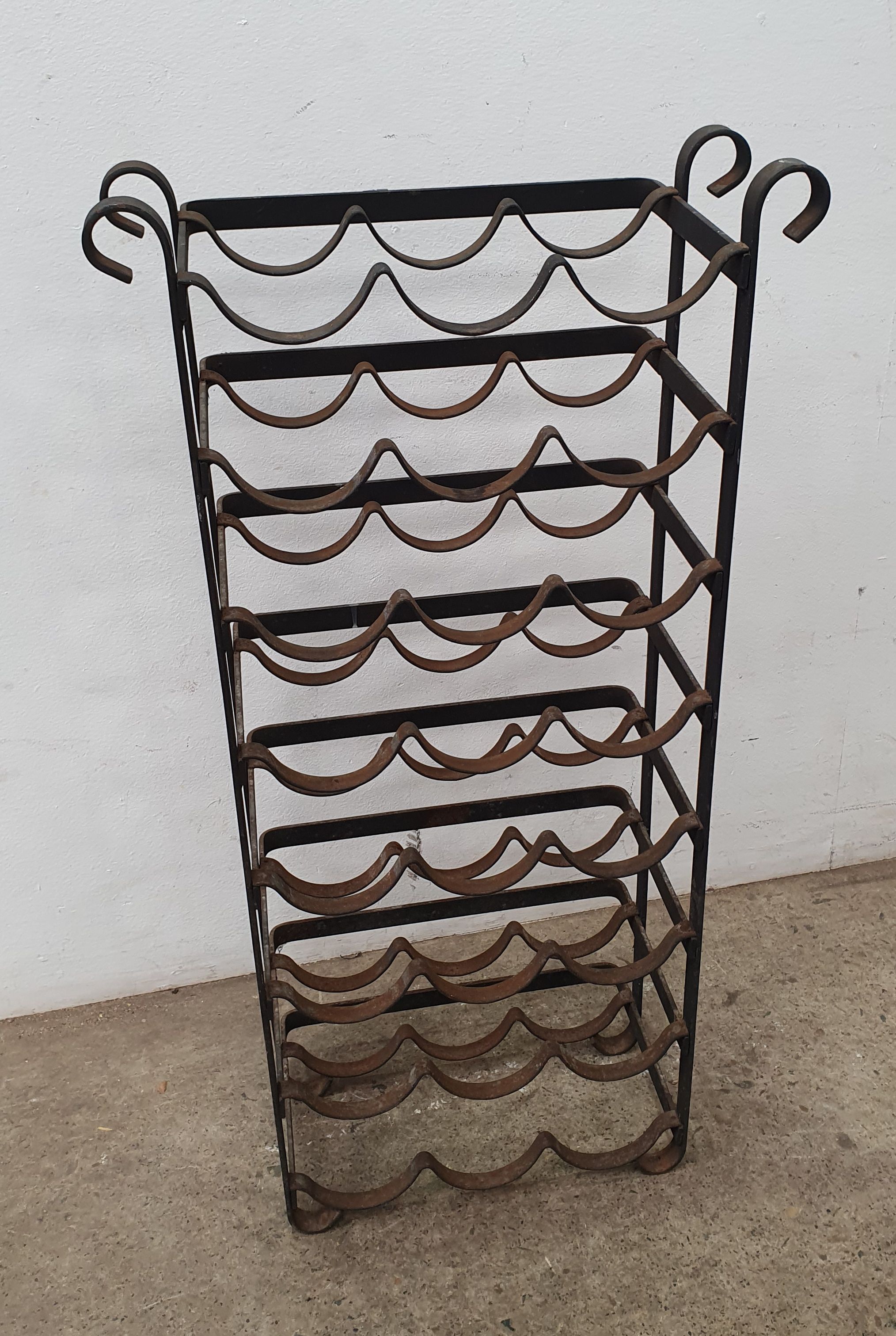 1002 · A WROUGHT IRON WINE RACK