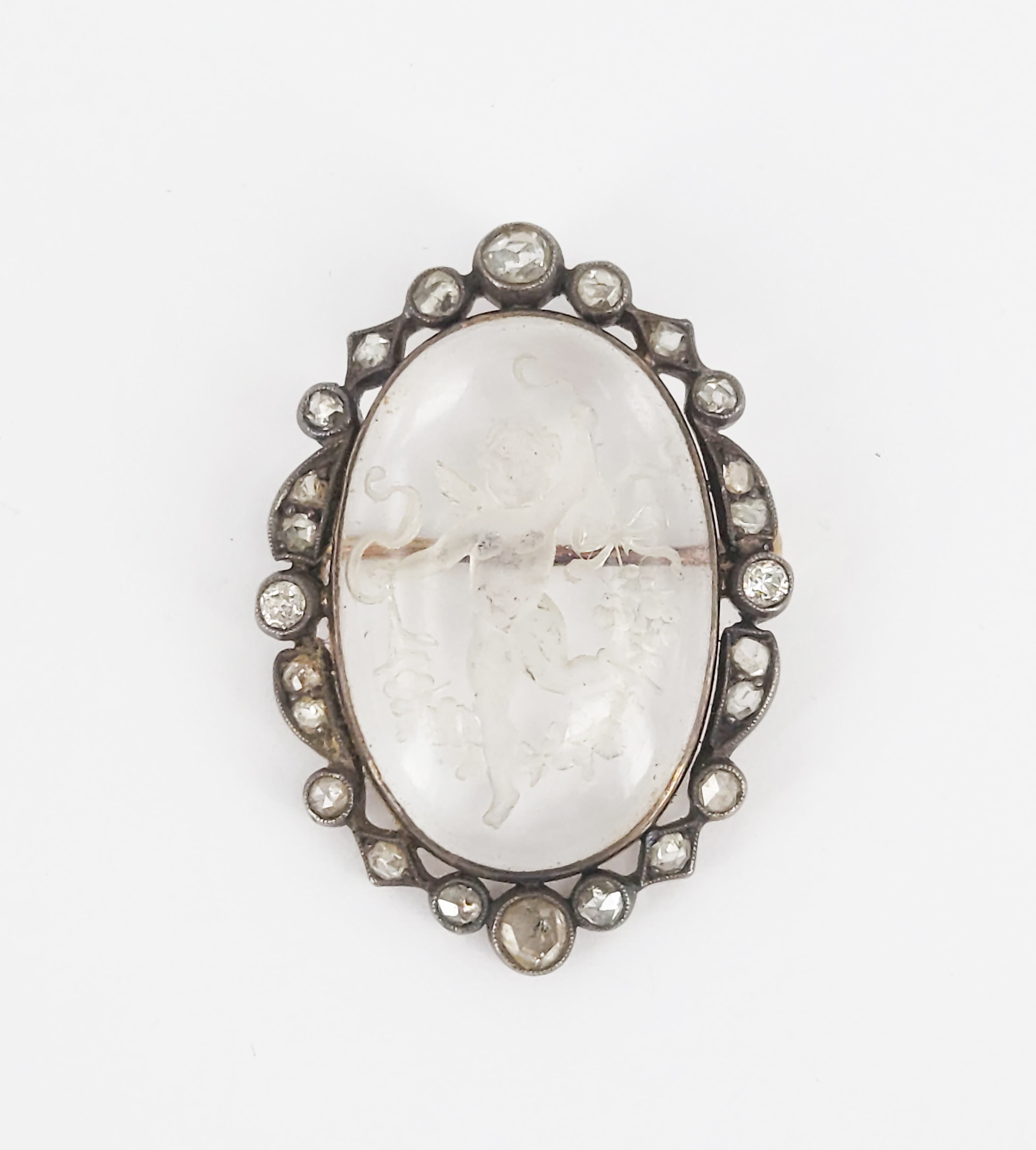 An Antique Silver And Rose Gold Reverse Intaglio Rock Crystal Brooch