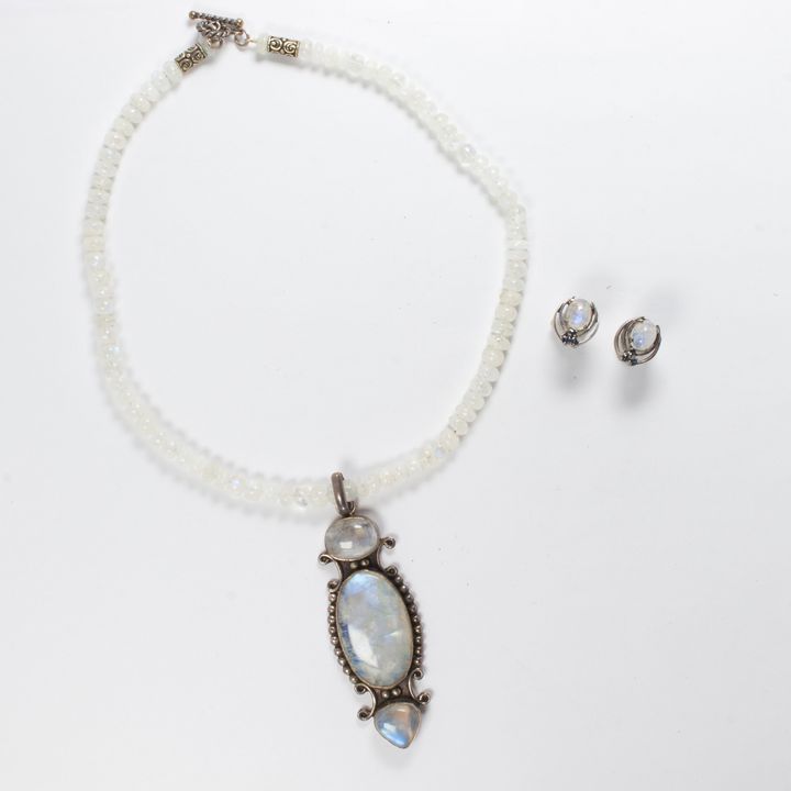 A set of iridescent gemstone and silver necklace and earrings