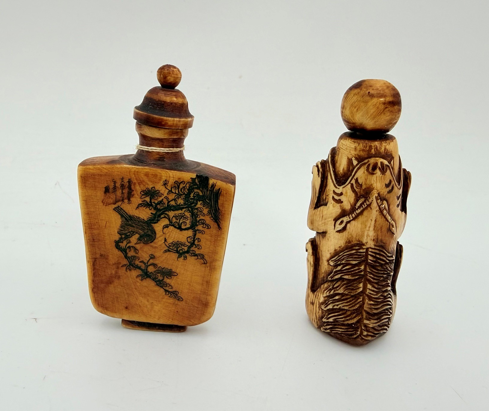 520 · TWO CHINESE STAINED BONE SNUFF BOTTLES