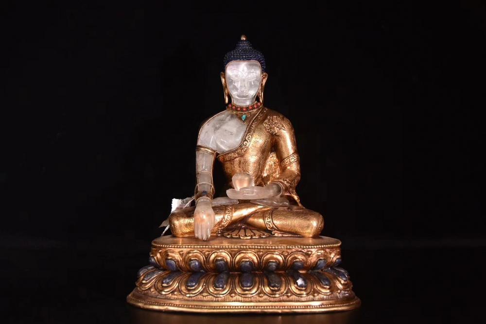 A Crystal And Gilt Bronze Molded Buddha Statue