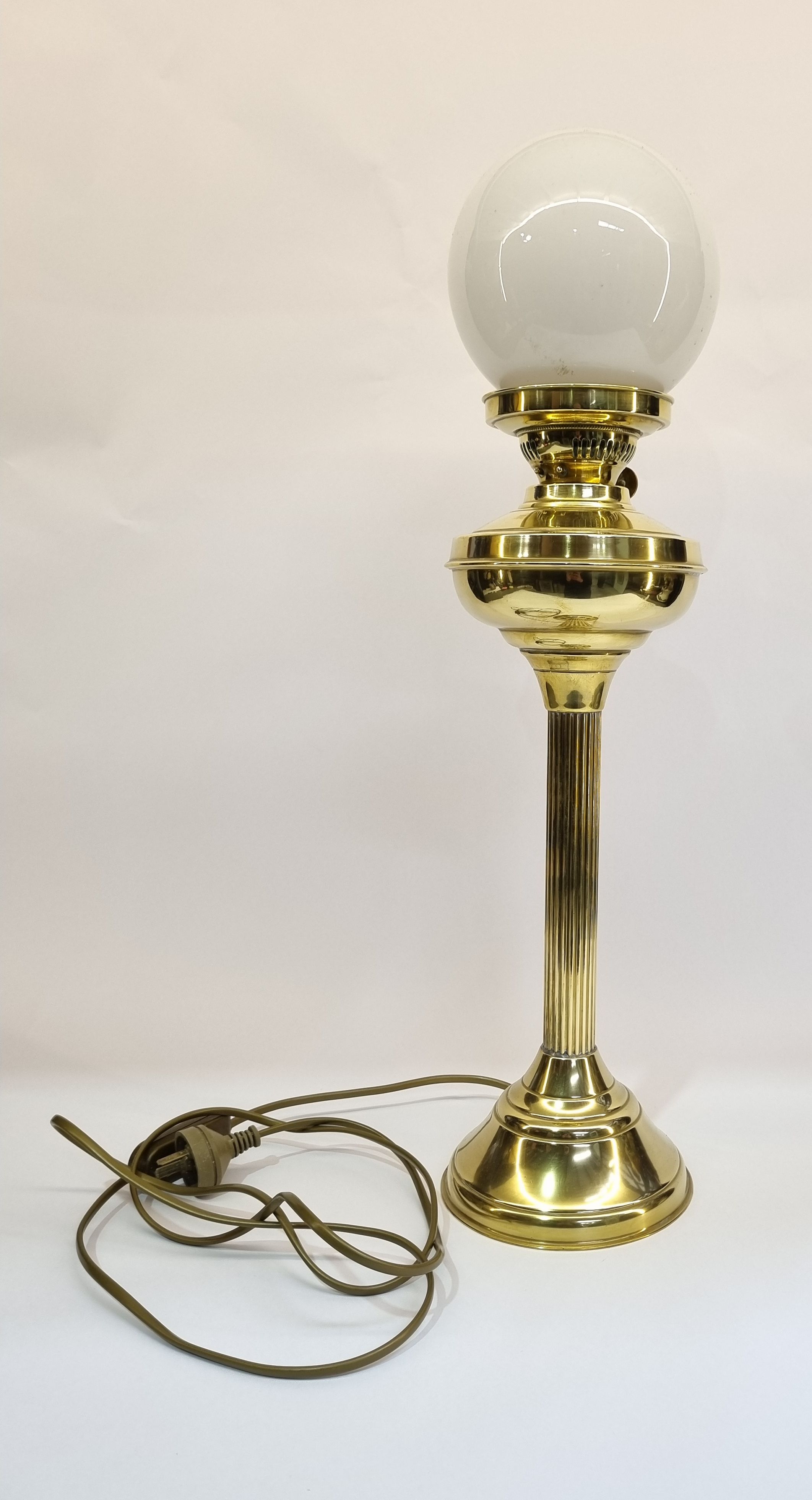 601 · A CORINTHIAN COLUMN BRASS OIL LAMP BASE
