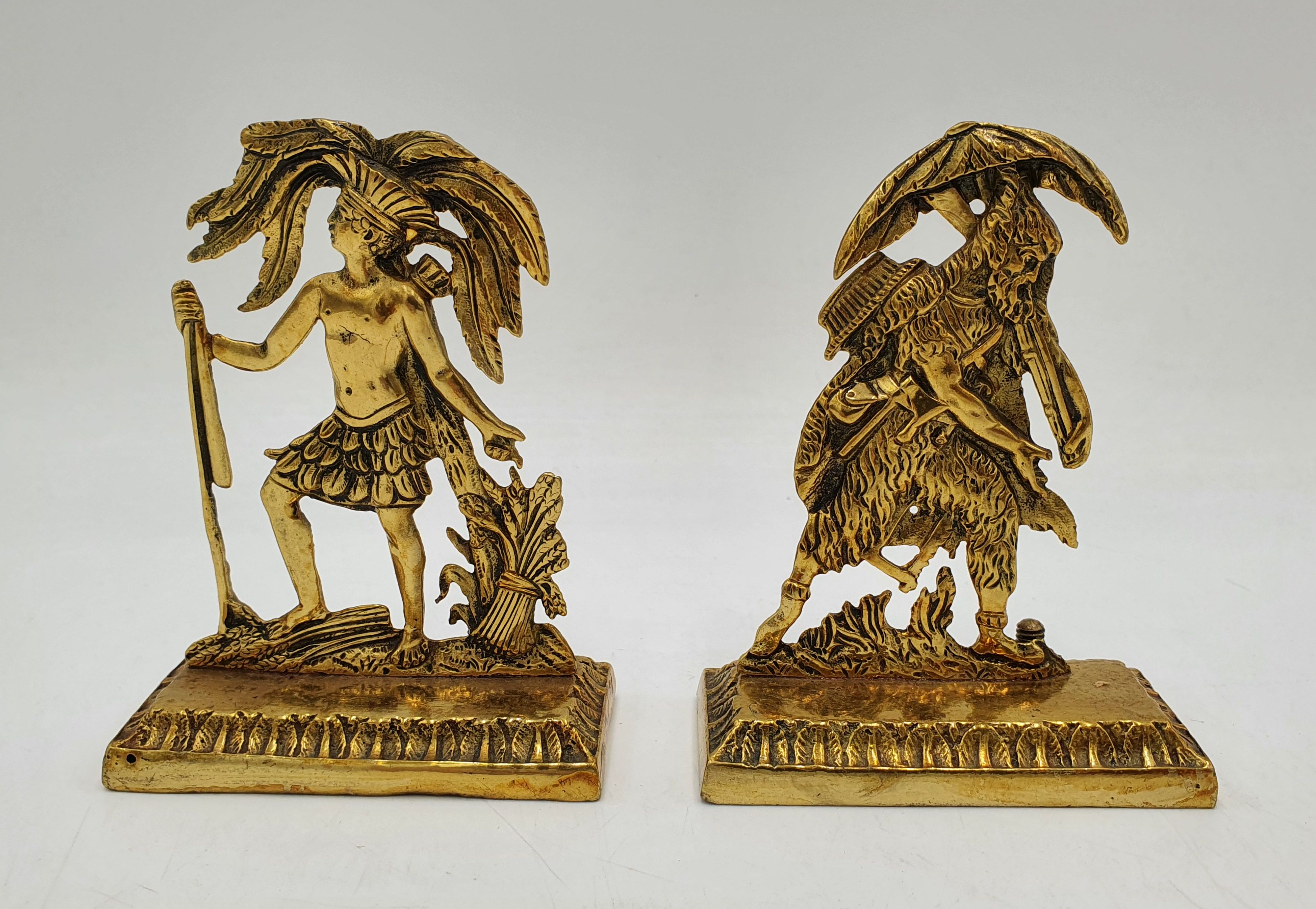 A Pair Of Gilt Metal Decorative Figures