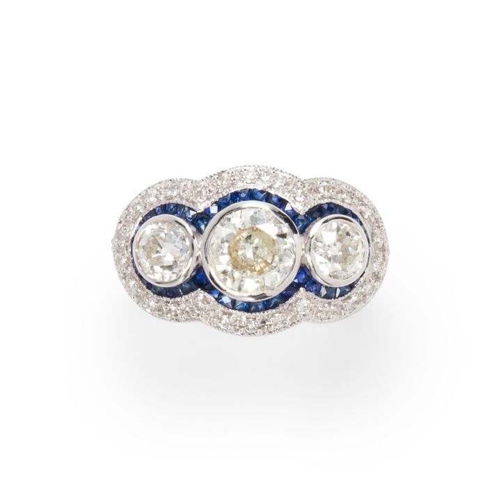 A diamond, sapphire and eighteen karat white gold ring
