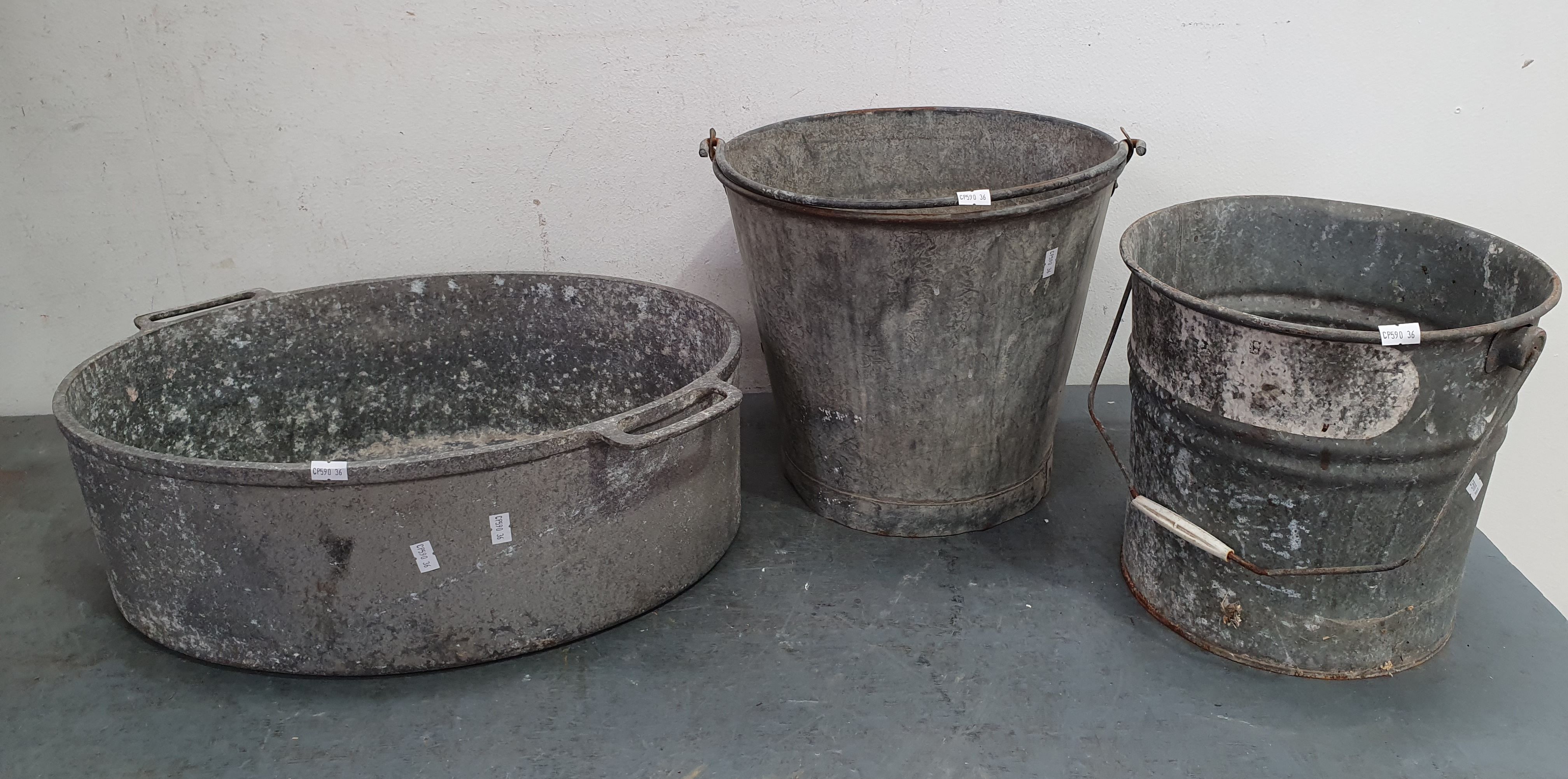1070 · A GROUP OF RUSTIC BUCKETS