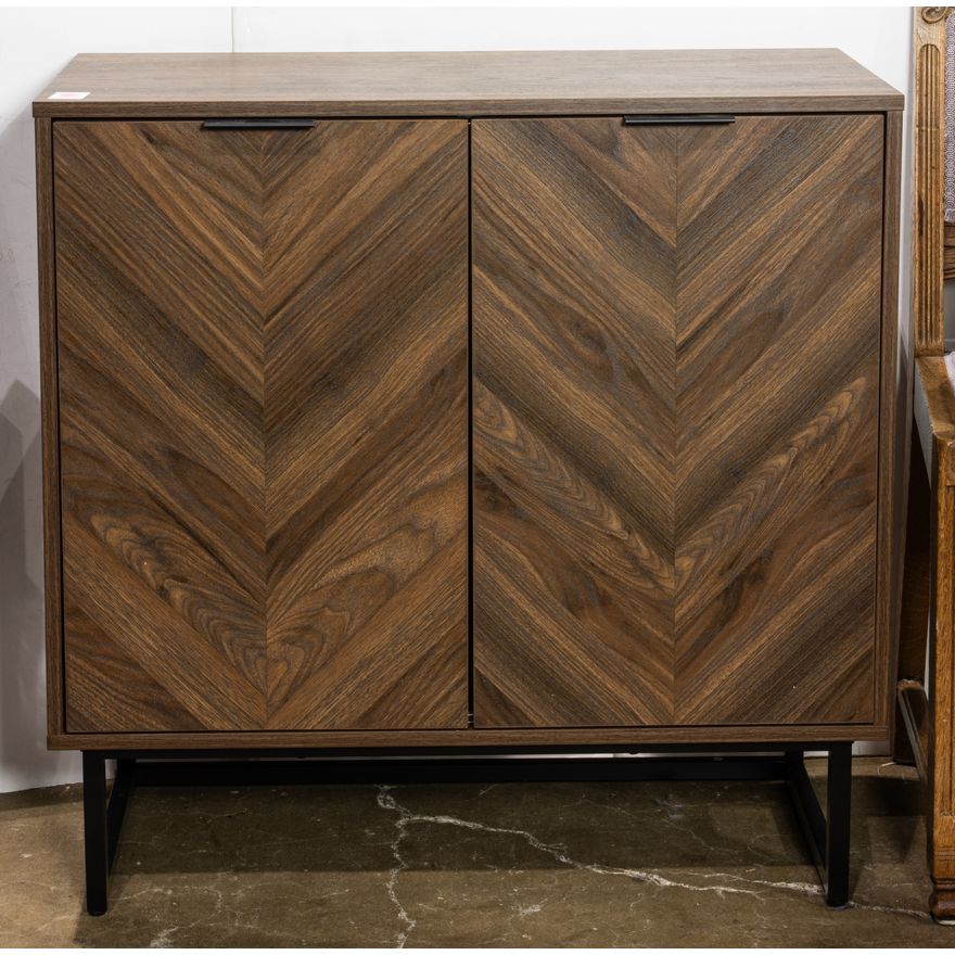 A contemporary faux wood grain laminate two door cabinet