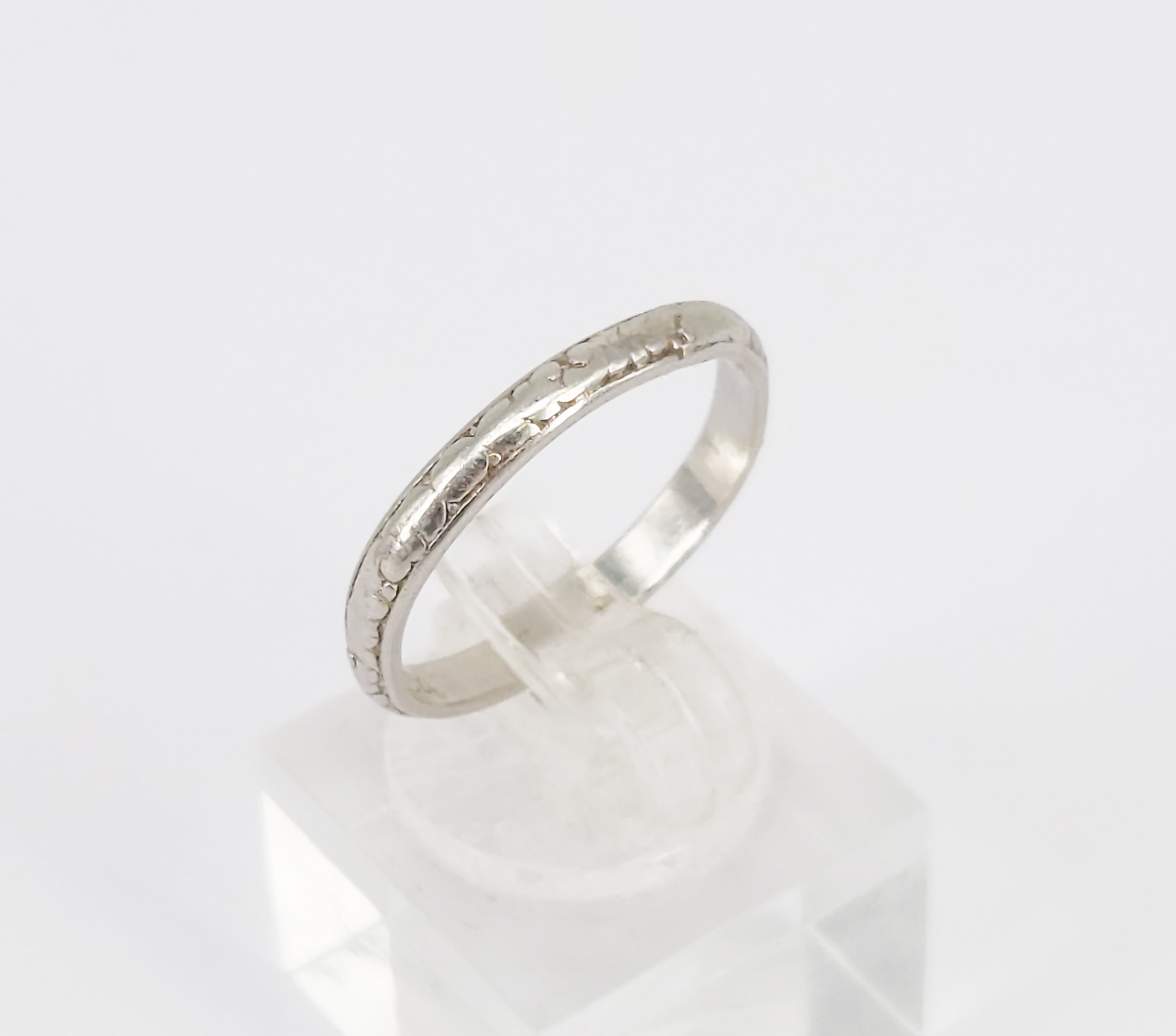 45 · A PLATINUM BAND RING