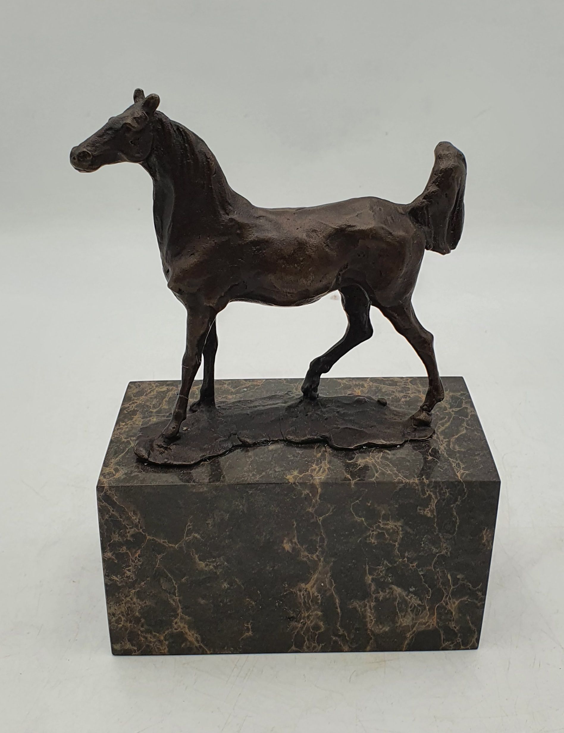 A BRONZED FIGURE OF A HORSE